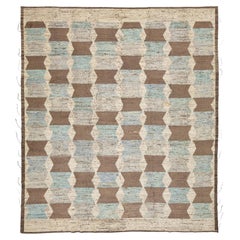 Tappeto in lana in stile marocchino moderno con motivi geometrici nei toni del marrone terra e del blu