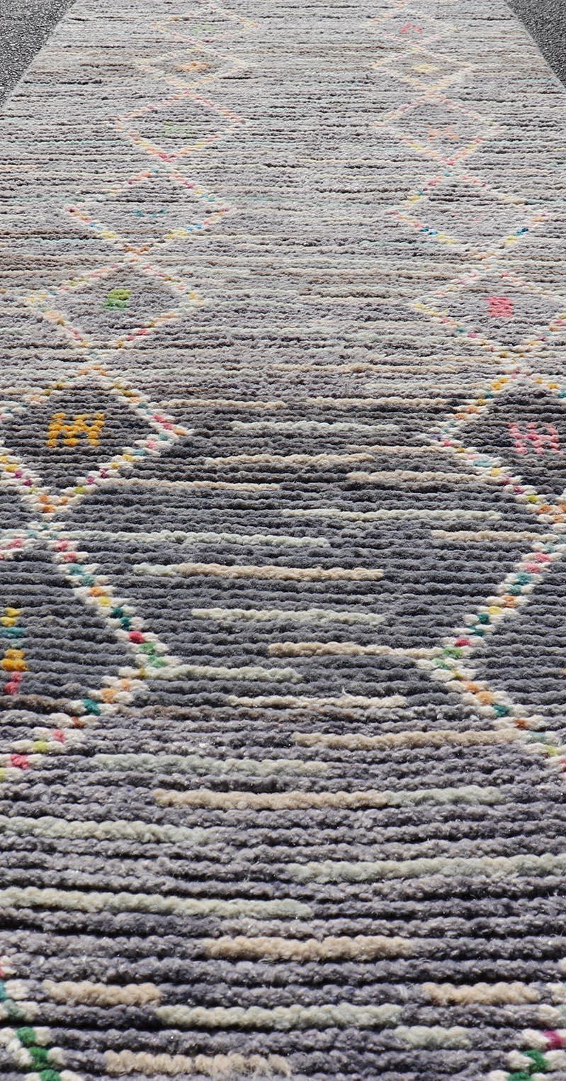 Modern Moroccan Tribal Designed Runner in Pastels Colors On A Grey Ground. Keivan Woven Arts; rug MSE-12807 Country of Origin: Afghanistan Type: Modern Casual  Design: All-Over, Tribal, Sub-Geometric. 
Measures: 2'5 x 8'4 
This Moroccan beautiful
