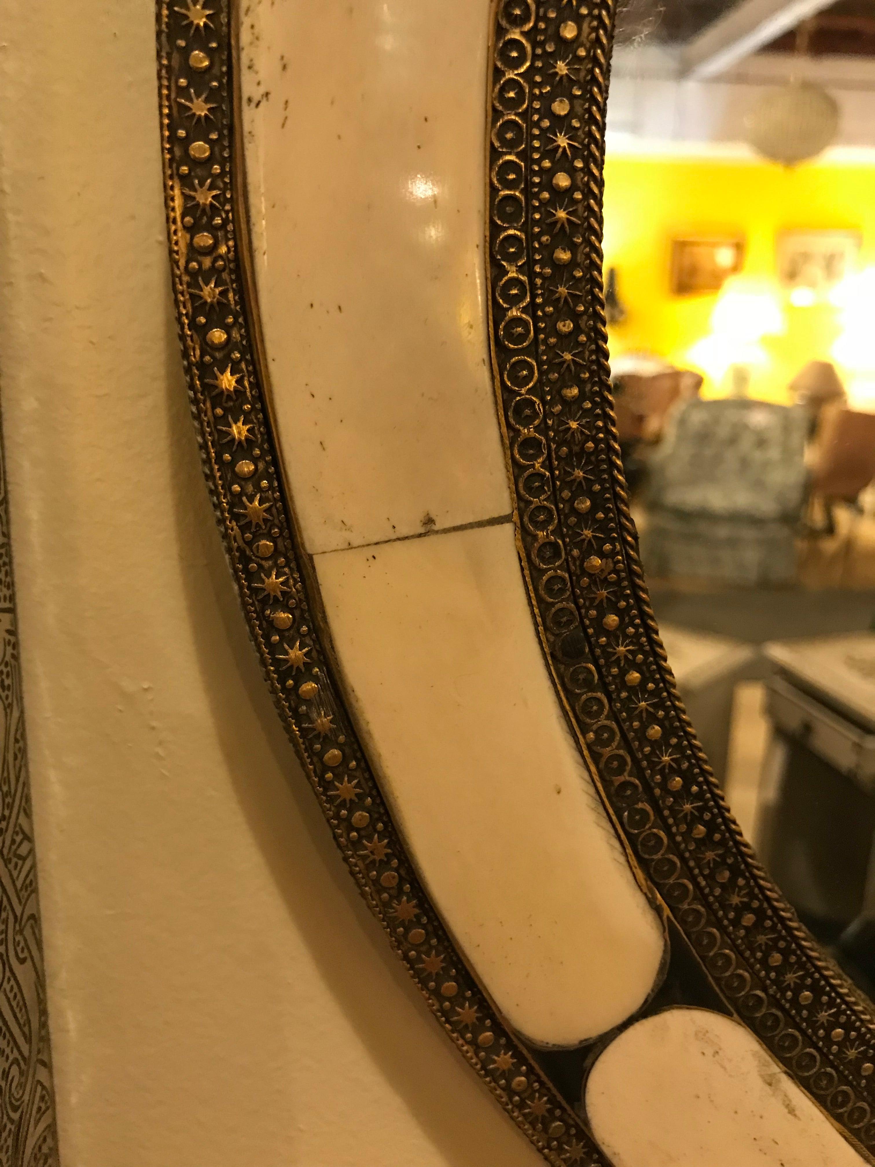 White Round Mirror in Hollywood Regency Style a Pair 
Handcrafted with bone and brass inlay and featuring beautiful design elements, this exquisite pair of mirrors brings a sense of robust elegance to any space.