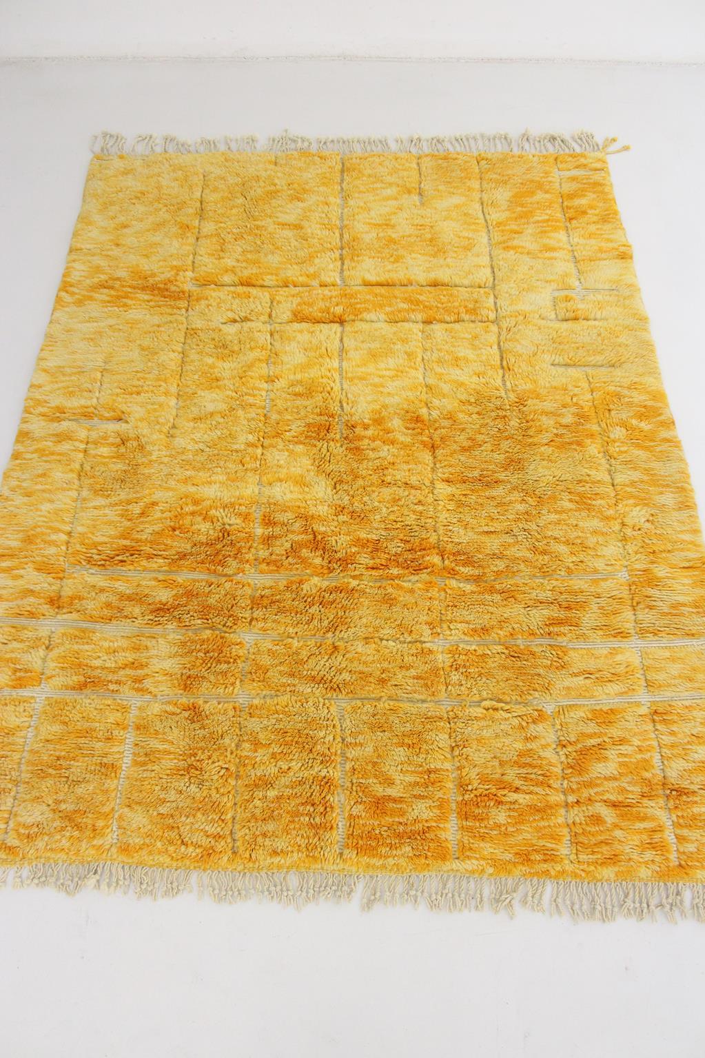 I sourced this modern-style, original Mrirt rug in the area of Khenifra, Atlas Mountains, Morocco. Groups of women there still weave by hand on traditional, vertical looms to make these new rugs.

Colors are different tones of a bright, warm yellow