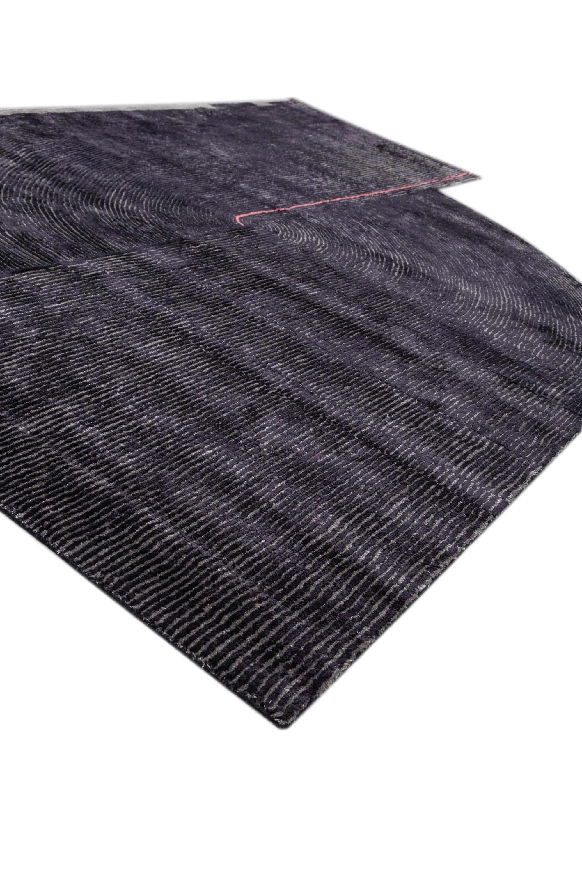 Embark on a design journey with this modern hand-tufted rug, a captivating masterpiece handmade in rural India. Like a canvas of self-expression, it celebrates diverse personalities through a playful blend of shapes reminiscent of origami's