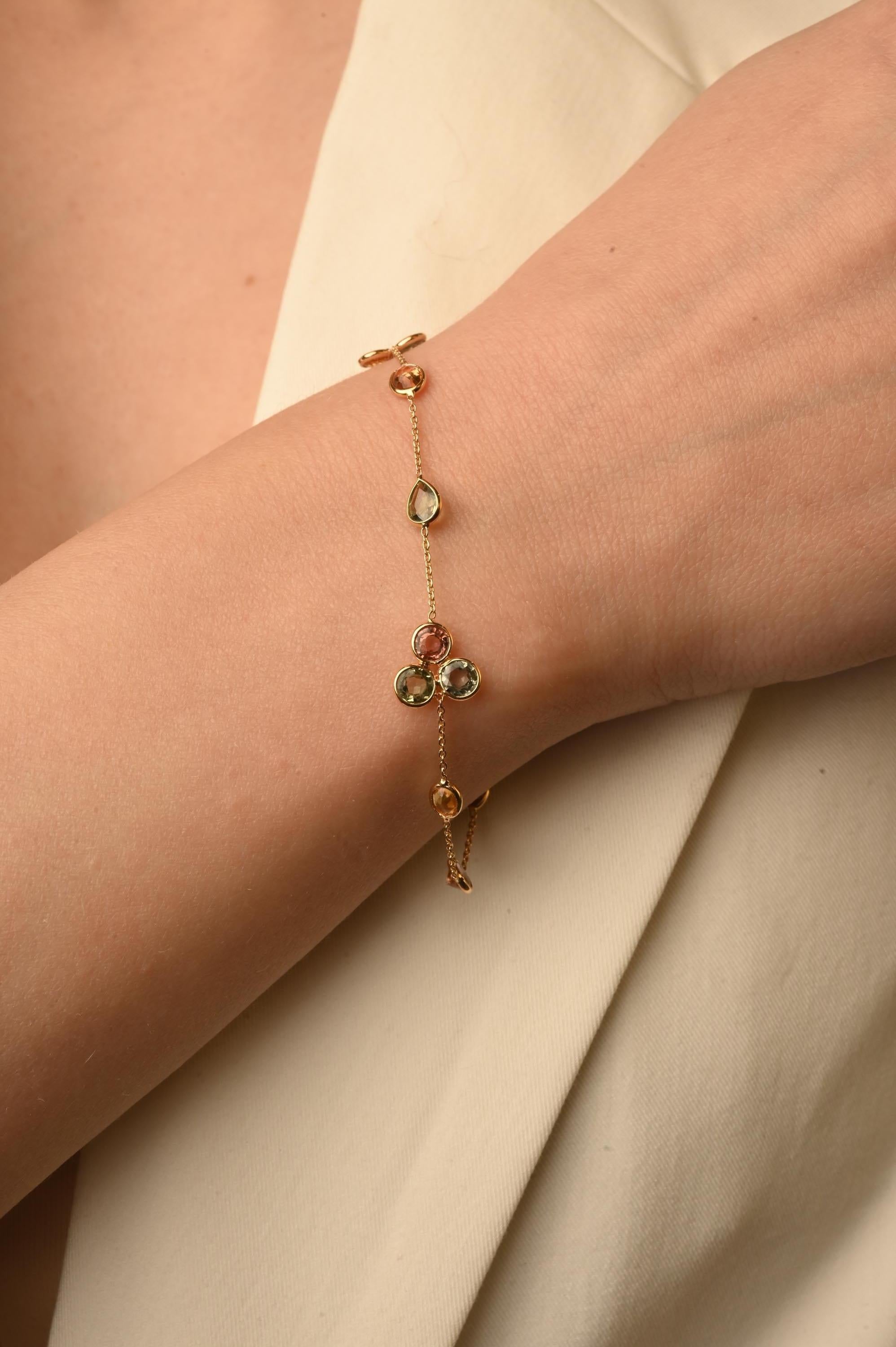 Multi sapphire dainty flower bracelet in 18k gold for women. A gold gemstone bracelet is the ultimate statement piece for every stylish woman.
Adorn your wrist with this beautiful mix cut multi sapphire chain bracelet in 18 Karat Gold. Each piece is
