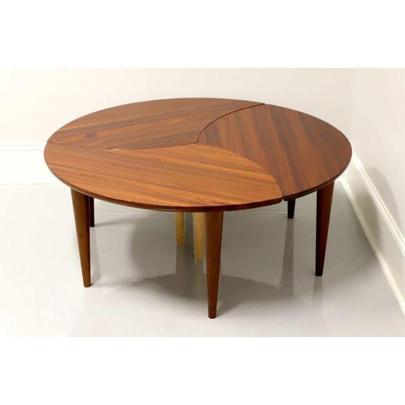 A set of three Modern tables, coffee table height, that fit together like puzzle pieces, by David Levy Creations. Tops are made from African Sapele and African Padauk with American Maple pinstripes. The legs are American Maple and African Sapele.