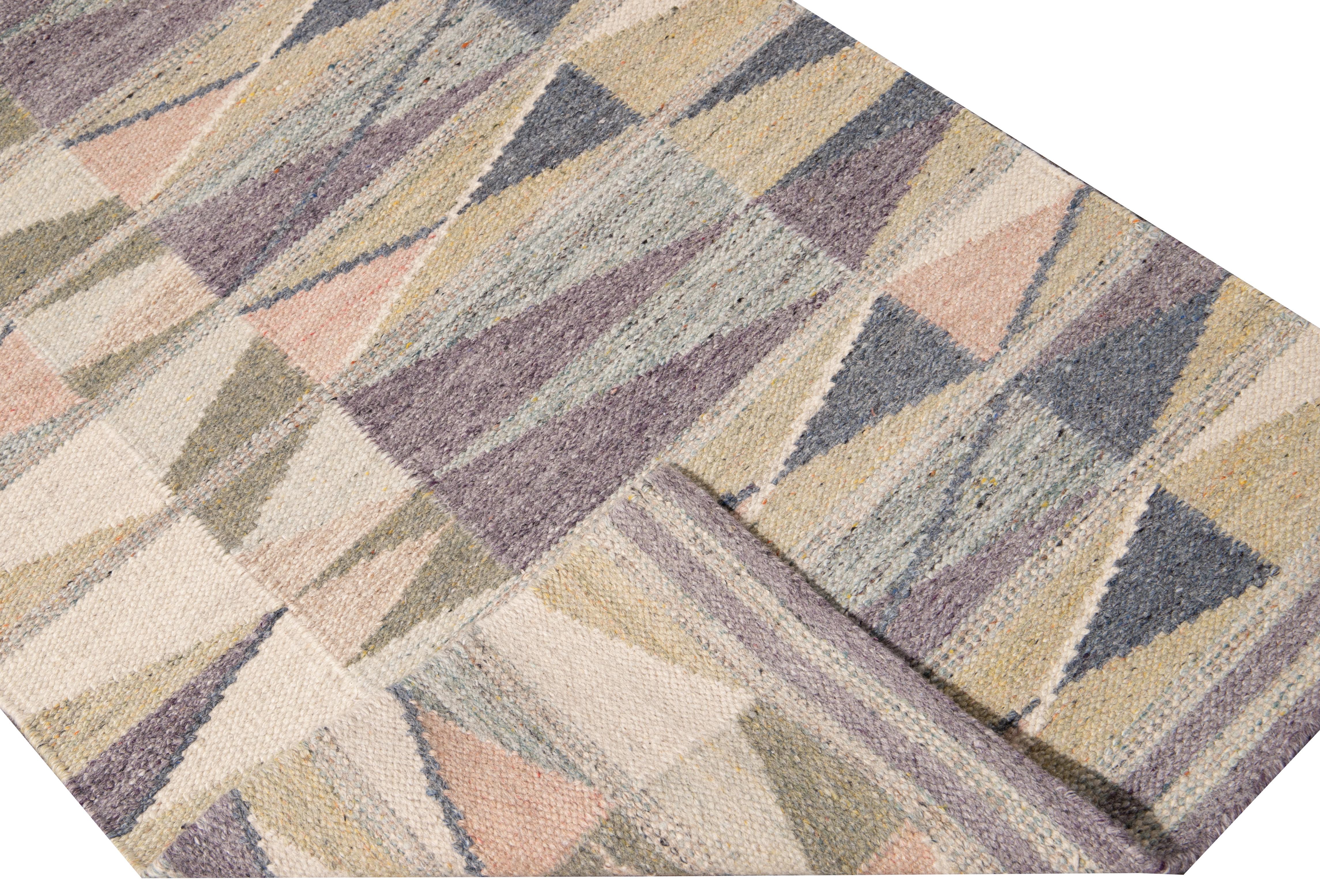 Beautiful modern long Swedish hand-knotted wool runner with a beige field. This Swedish runner has accents of peach, green, and purple in an all-over geometric abstract design.

This rug measures: 3'1