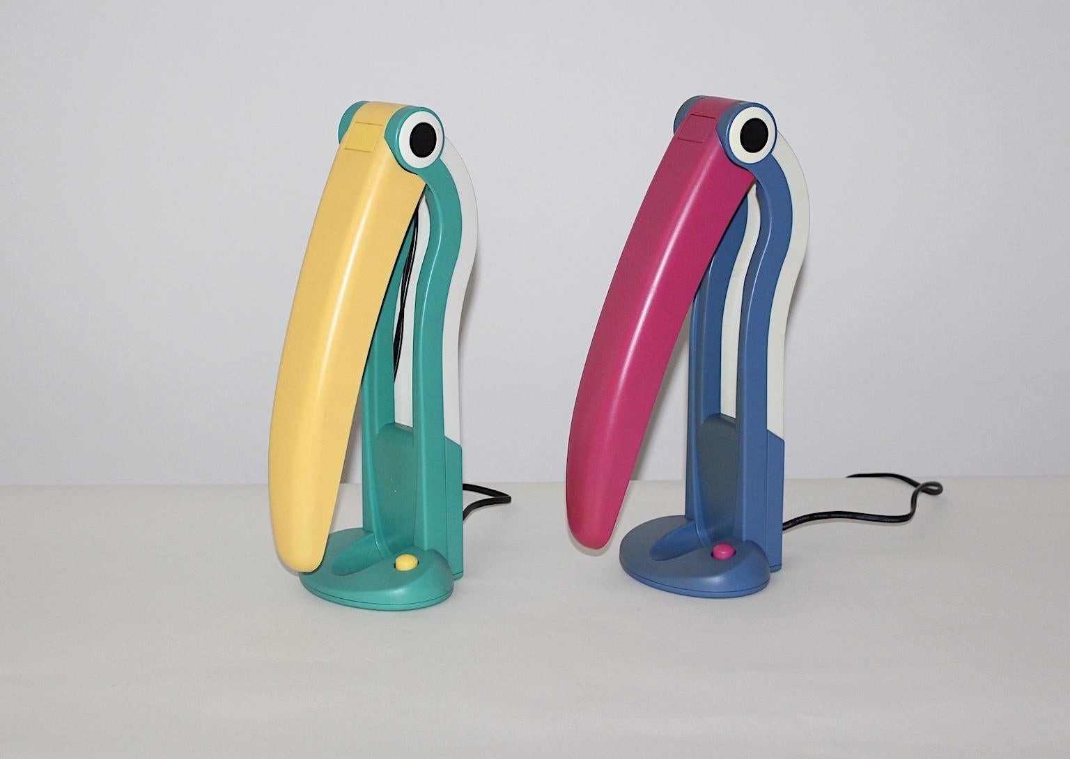 This pair of multicolored vintage table lamps by H.T.Huang, Taiwan 1980s was made of plastic.
The table lamps are shaped like toucans, while the beak opens and closes altering the light ´s shades. Labeled underneath
The vintage condition is very