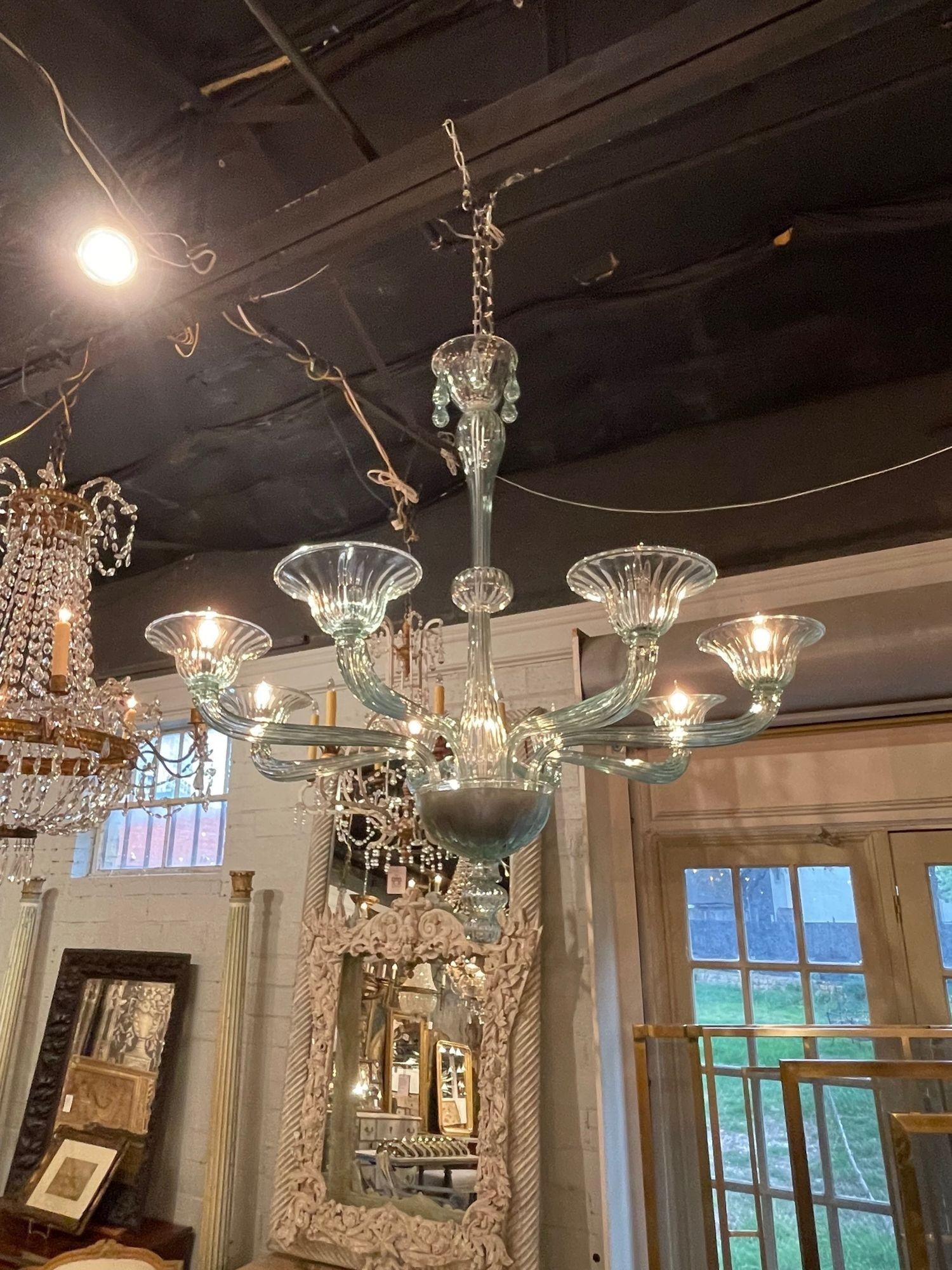 Stylish modern 8 light Murano glass chandelier in Fontana green. Beautiful glistening hand blown glass in such a pretty color! A true work of art!.