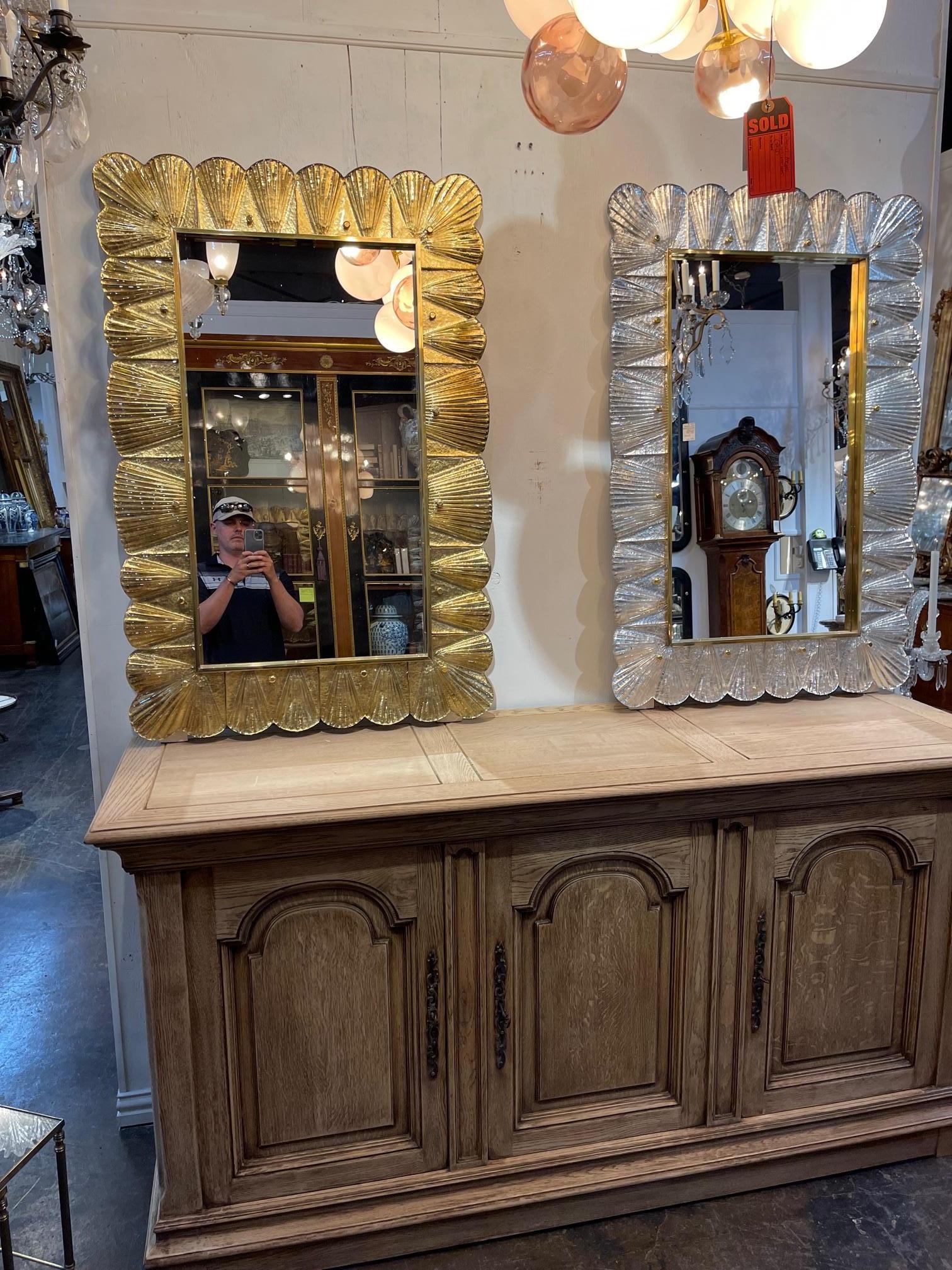 Beautiful decorative gold Murano glass and brass mirror. The gold glass has a very pretty ruffled effect. Lovely!! Note there are 2 available. Price listed is for 1.