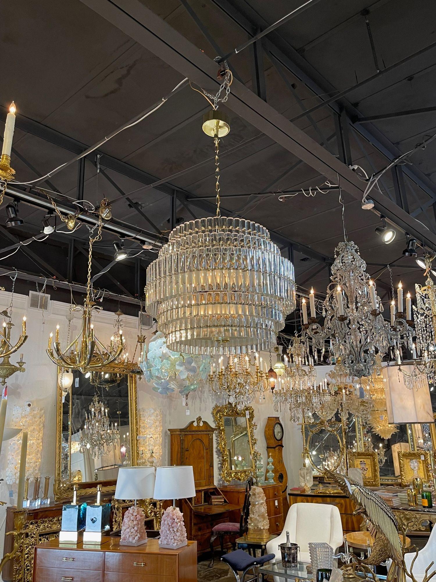 Very elegant modern Murano glass and brass multi-tiered drum form chandelier. Beautiful scale and shape and glistening glass make this a superb fixture.  Outstanding!!