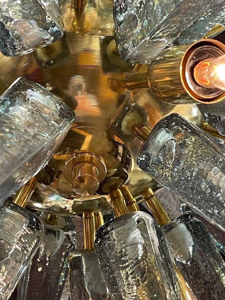 Stunning modern Murano glass and brass sputnik chandelier is beautiful fontana green. A unique fixture that is a true work of art!!