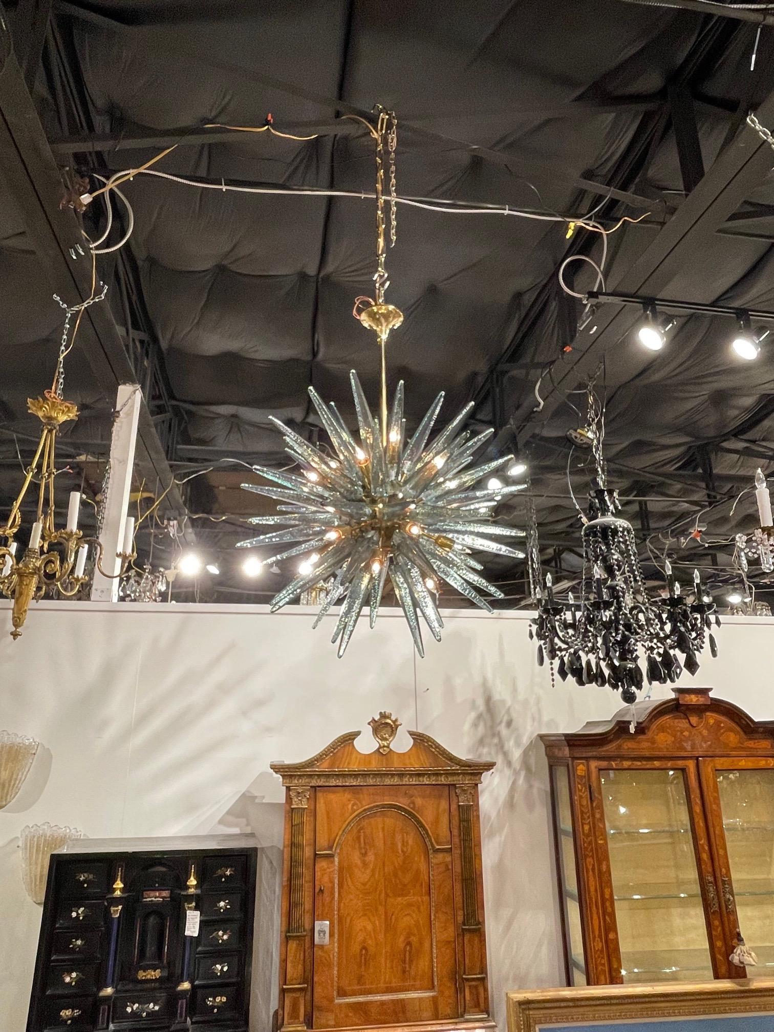 Stunning modern Murano glass and brass sputnik chandelier is beautiful fontano green. A unique fixture that is a true work of art!!