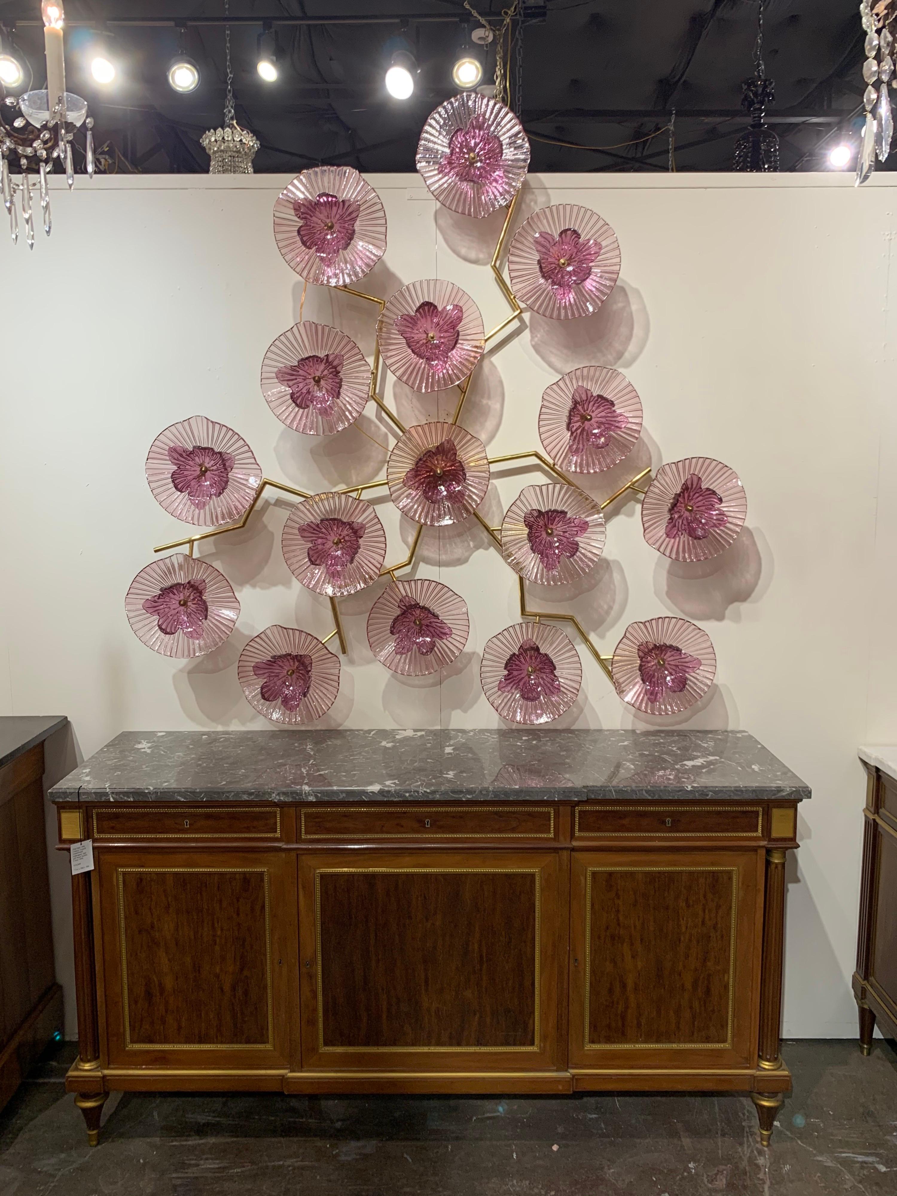 Spectacular modern purple Murano glass flower form wall art on a brass frame. Beautiful delicate flowers light up! A fabulous impact piece that is a real work of art!
