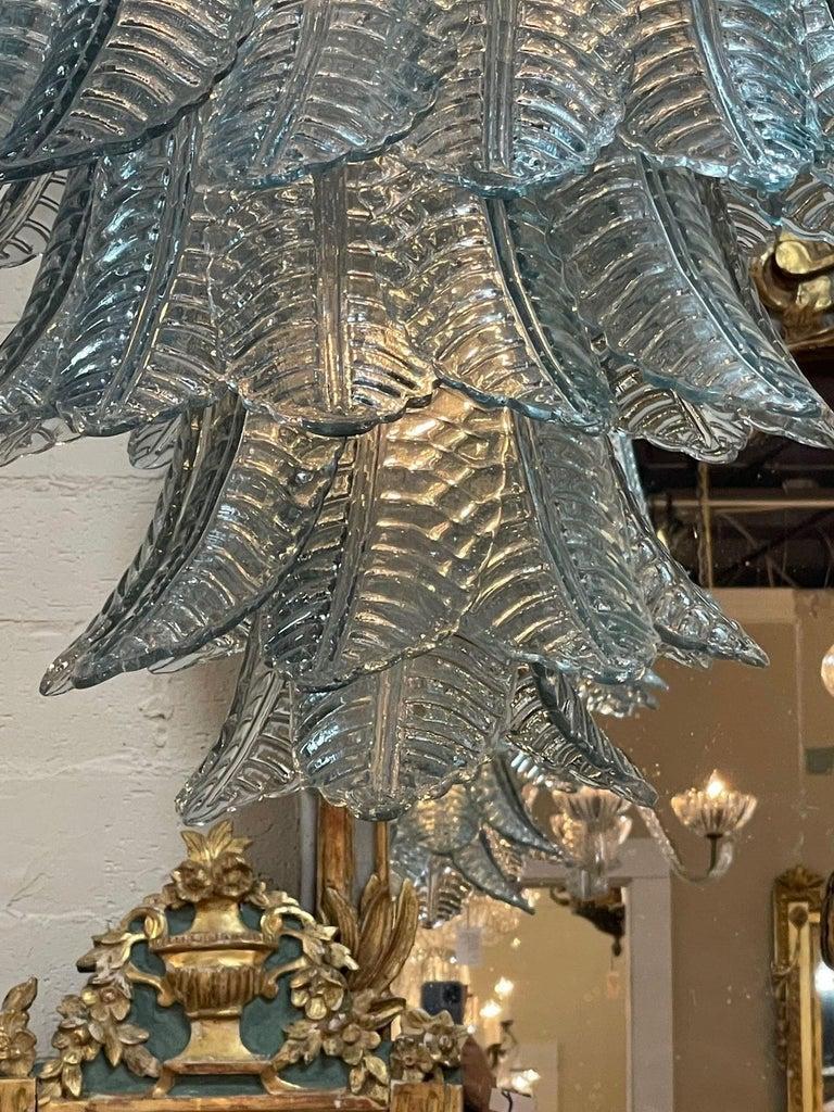 Fabulous modern aqua blue Murano glass waterfall chandelier. Featuring beautiful glistening glass in the shape of palm leaves. Makes an impressive statement! Gorgeous!