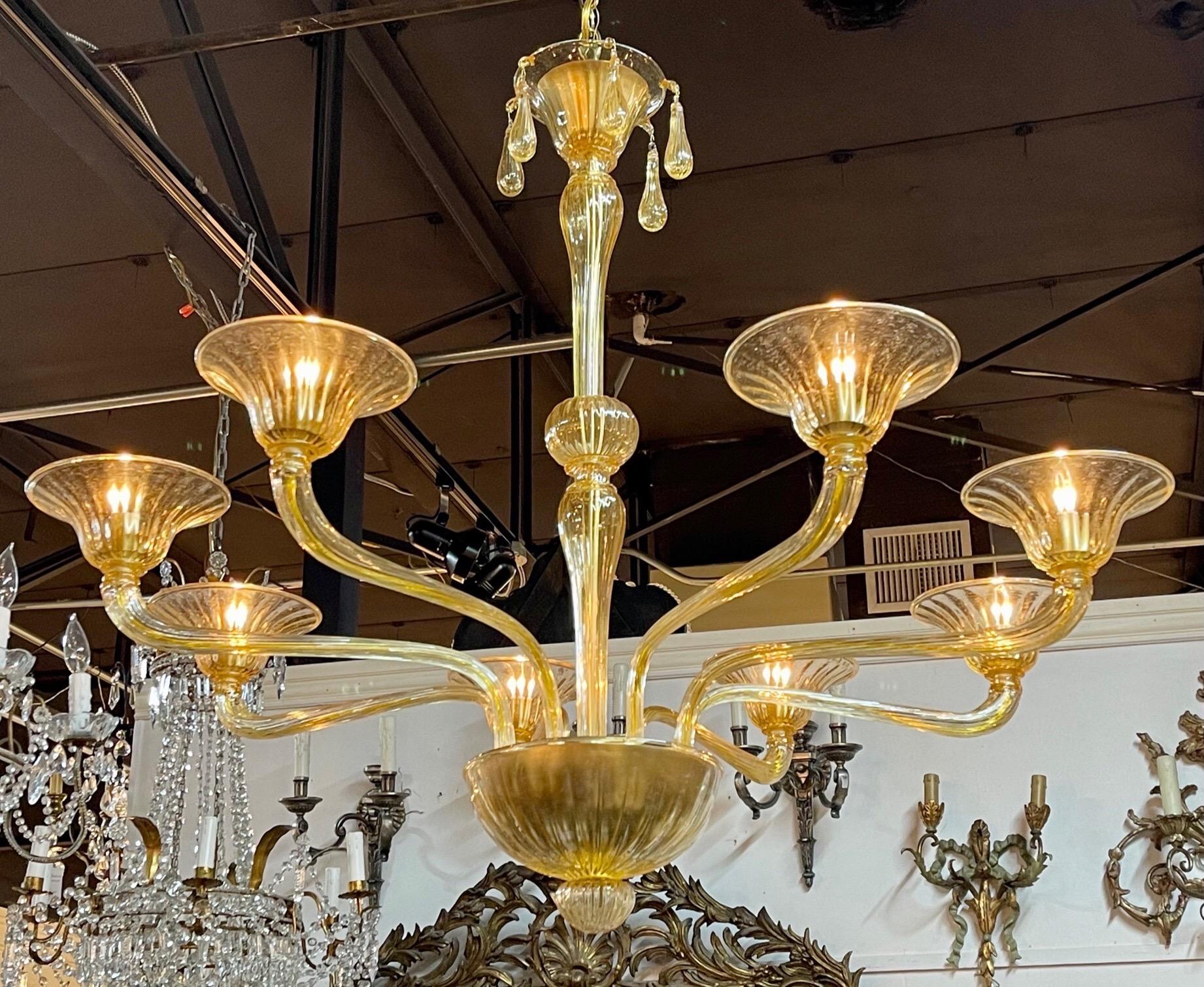 Decorative modern gold Murano glass chandelier with 8 arms. Great for a high end designer look!!