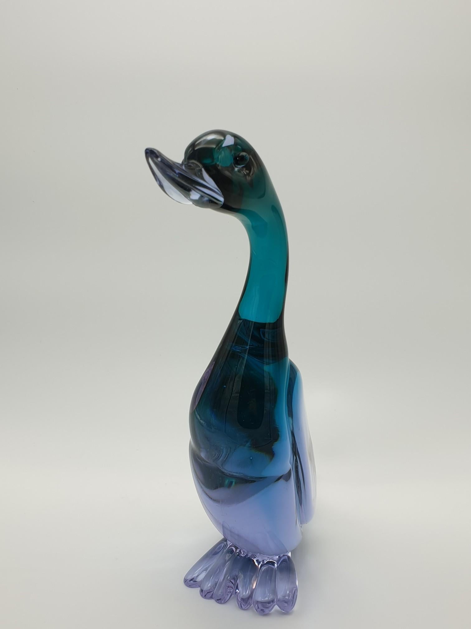 Large Murano glass duck, 39cm tall, made in the 1970s in the island of Murano (Venice, Italy) by the glass-factory Gino Cenedese e Figlio. The lavender color made at Cenedese is very attractive and peculiar, as its hue changes depending on the