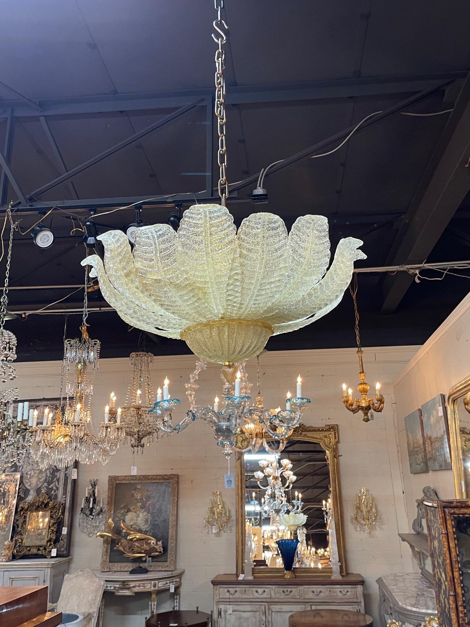 Decorative modern Murano gold crusted flush mount chandelier. Featuring glistening leaf shaped glass. Stunning!.