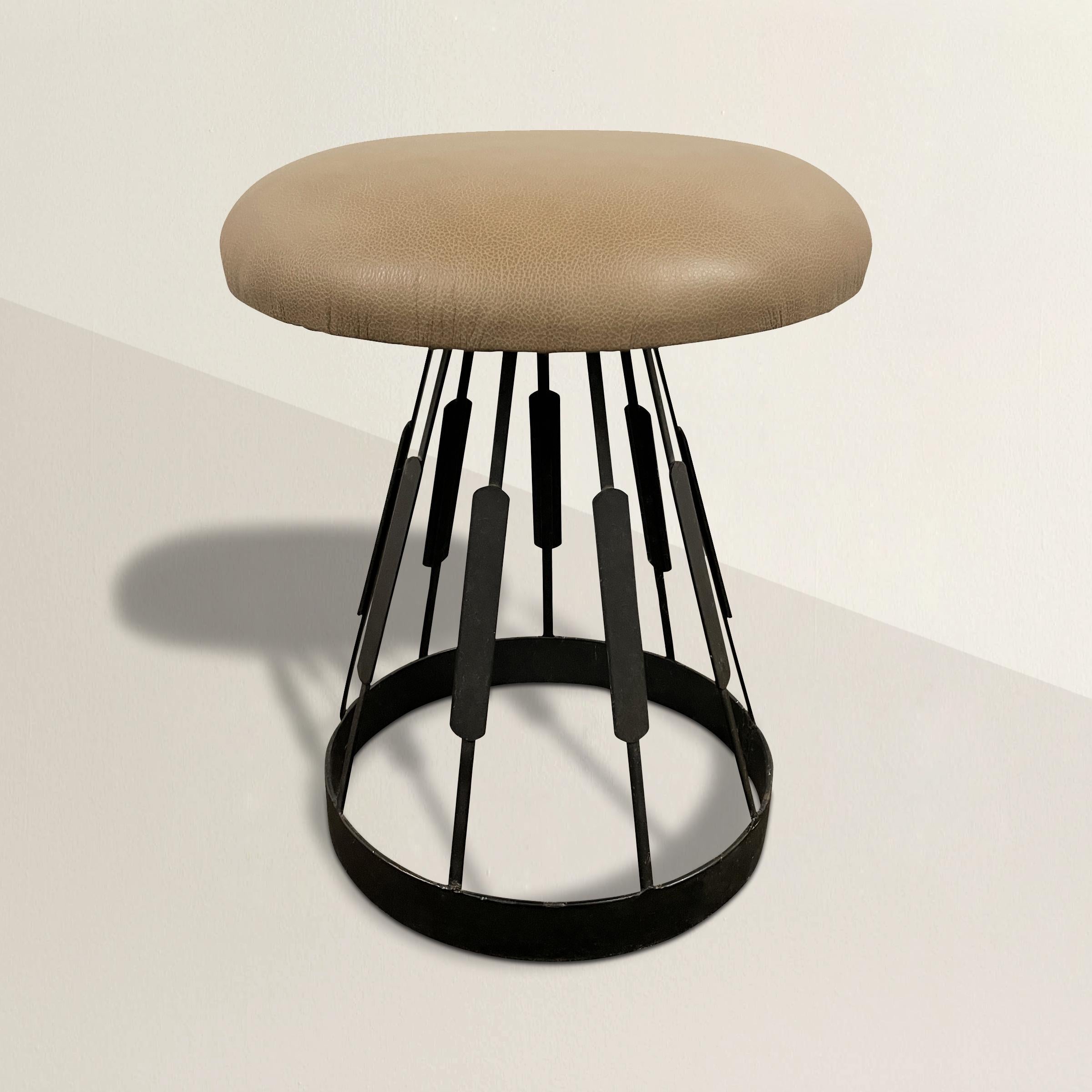 A wonderfully whimsical mid-20th century American mushroom-form stool with a groovy steel frame supporting a newly upholstered taupe leather seat. The perfect extra seat for your guests, or use daily in your home office.