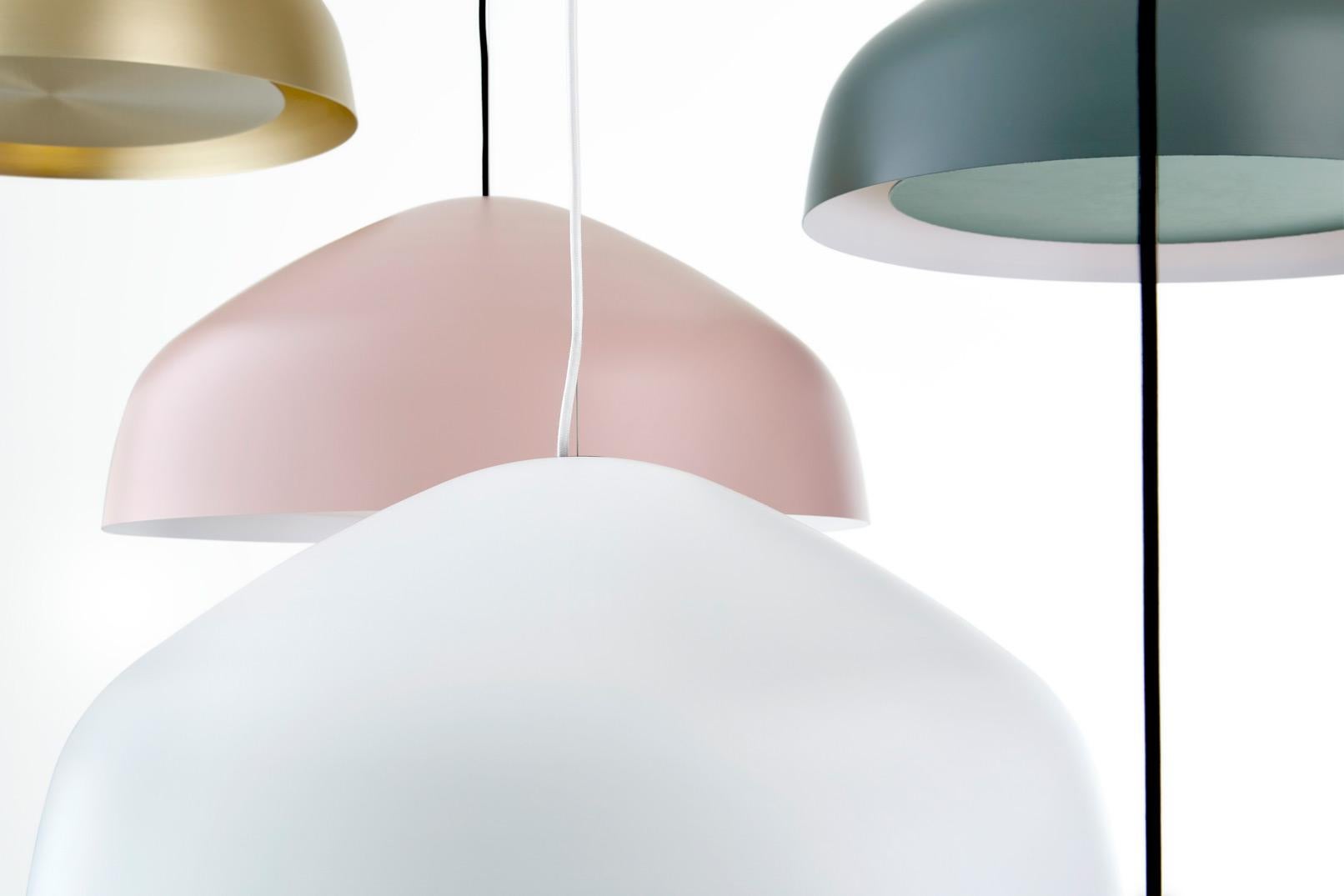 Sitting between the timeless and the contemporary, the Ora pendant by Ross Gardam, features a floating disk surrounded by a beautifully gentle glow. This striking aluminum pendant is hand-spun and includes a 5