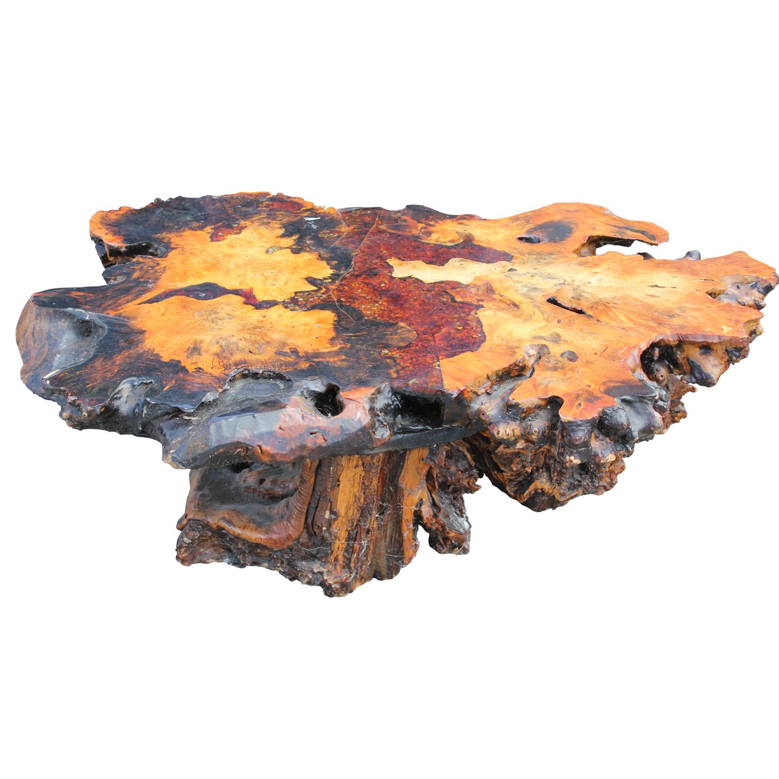Modern burl root coffee table with amber colored tumbled glass inlayed that cascades through the center, giving it an extra dimension and pop and sealed with a urethane / resin coat. Truly marvelous. In the style of Nakashima.