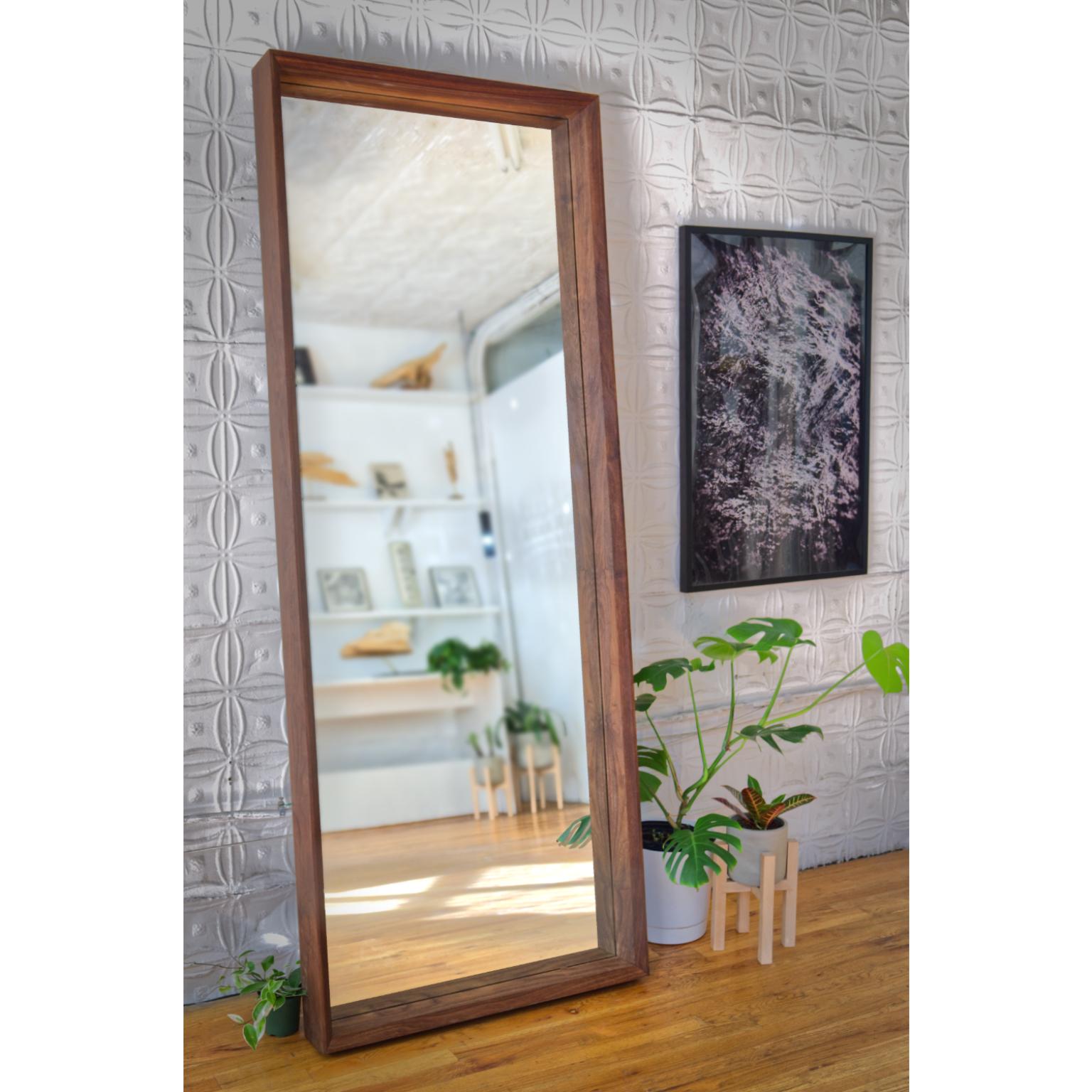 Constructed from solid American walnut, the mirror is a portal to another universe. Standing at 6’+ tall it doubles space and stands at your favorite wall for the creation of the day's outfit and beyond. The frame on this mirror double chamfers for