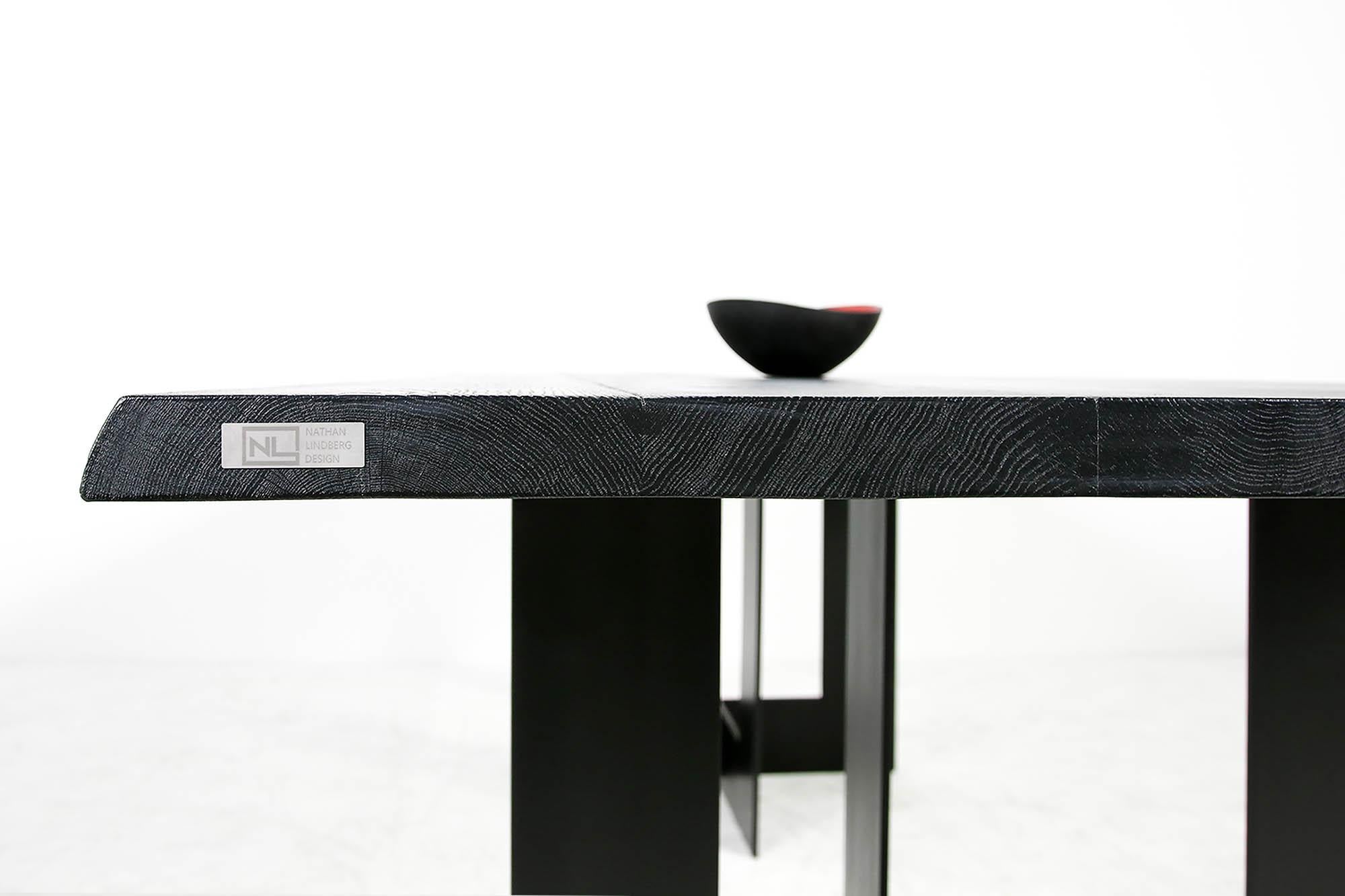 Beautiful contemporary Nathan Lindberg table, Mod. NL51 with a two-part heavyweight black matte finish steel base and a solid 45mm (1.8in.) brushed oak table top with beautiful structure, also heavyweight and black matte finish. This piece can be