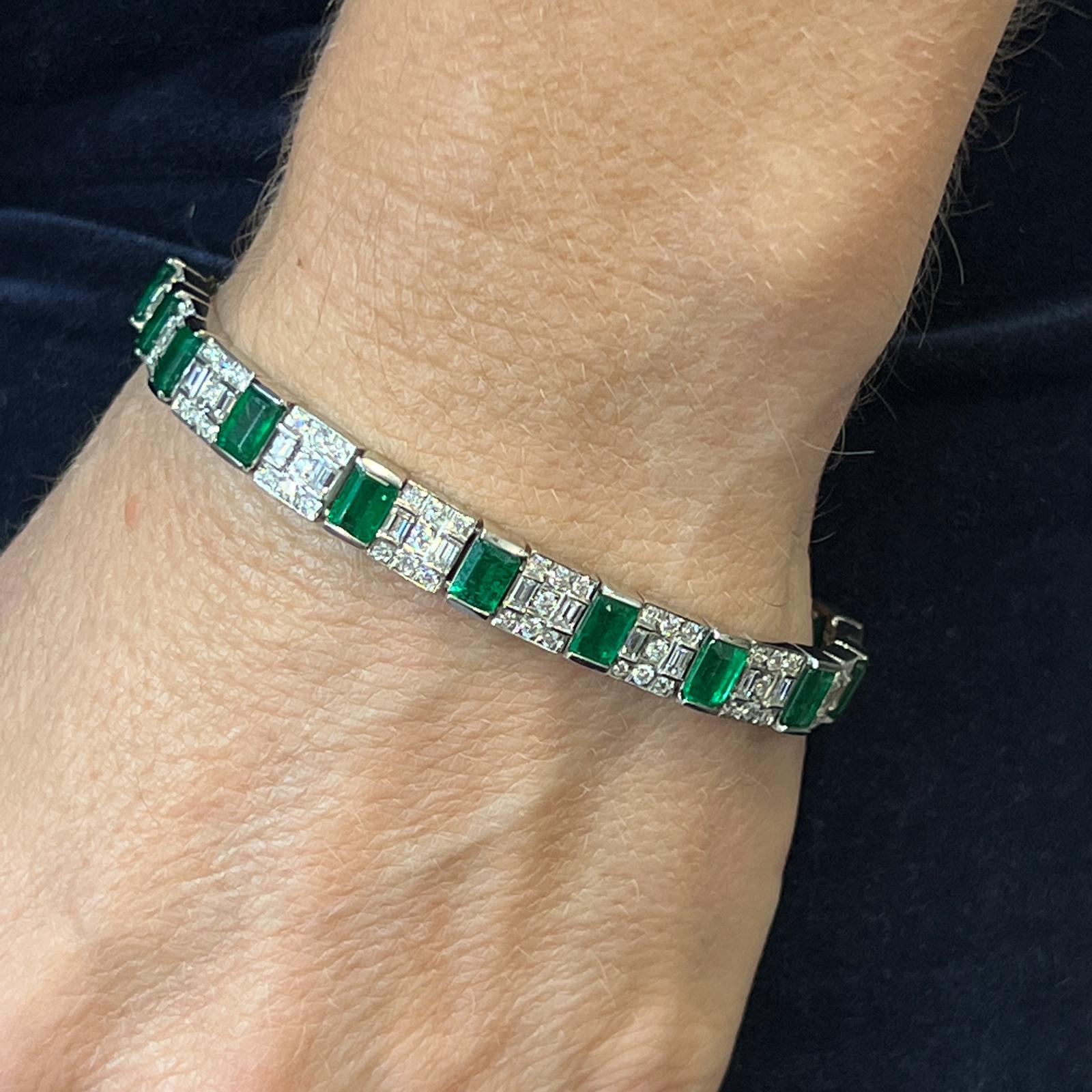Stunning emerald and diamond bracelet handcrafted in platinum. The bracelet features 17 emerald cut natural rich green emeralds weighing 8.36 carat total weight. The beautifully matched emeralds alternate with round brilliant and baguette cut
