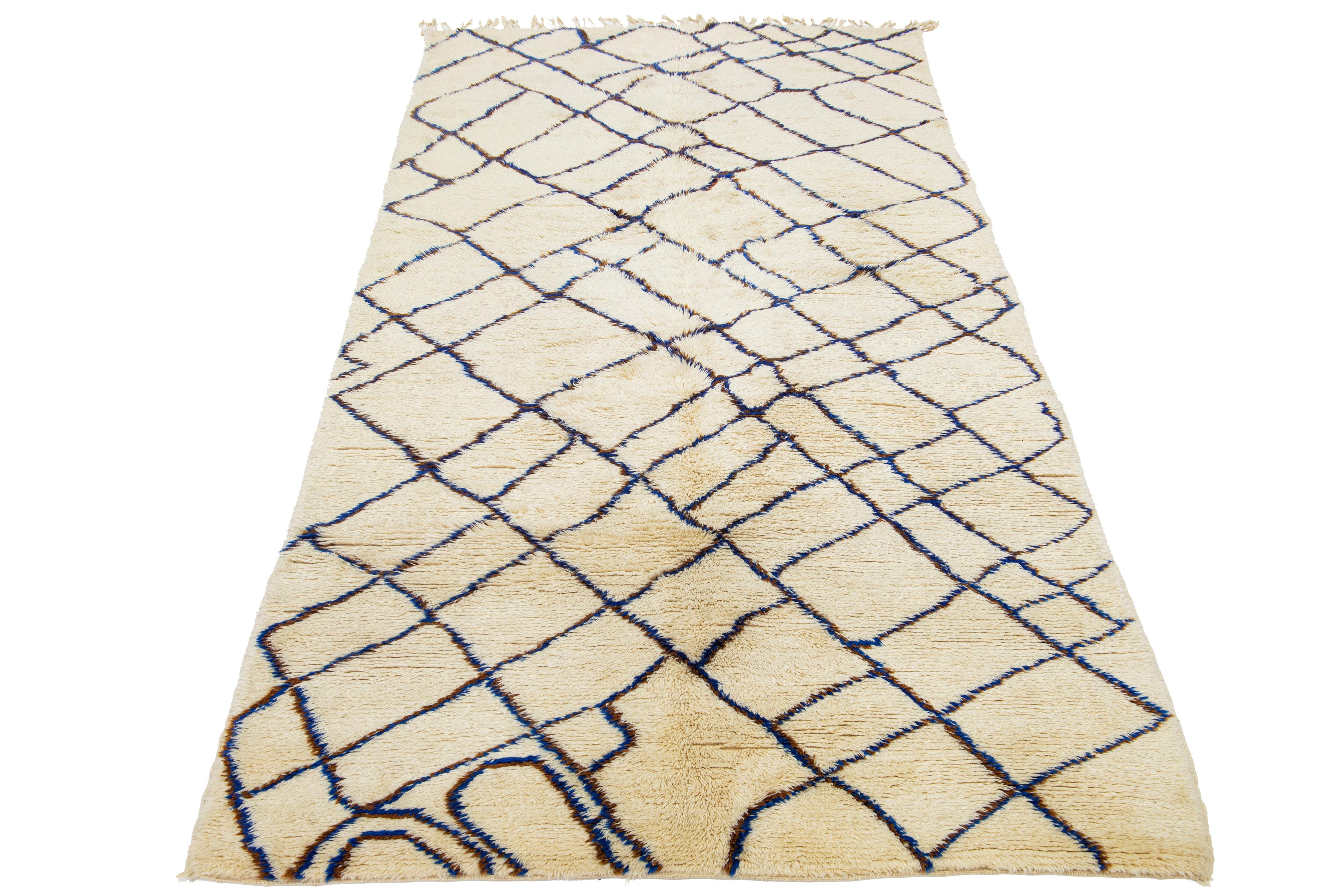 This beautiful, modern Moroccan, hand-knotted wool rug features a natural ivory field. Highlights a stunning, soft, linear design with fringes on the ends.

This rug measures 6'1