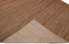 Tapis moderne de zone en jute et coton marron à texture naturelle tissé à la main