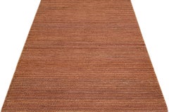 Tappeto moderno con texture naturale intrecciata a mano in iuta e cotone