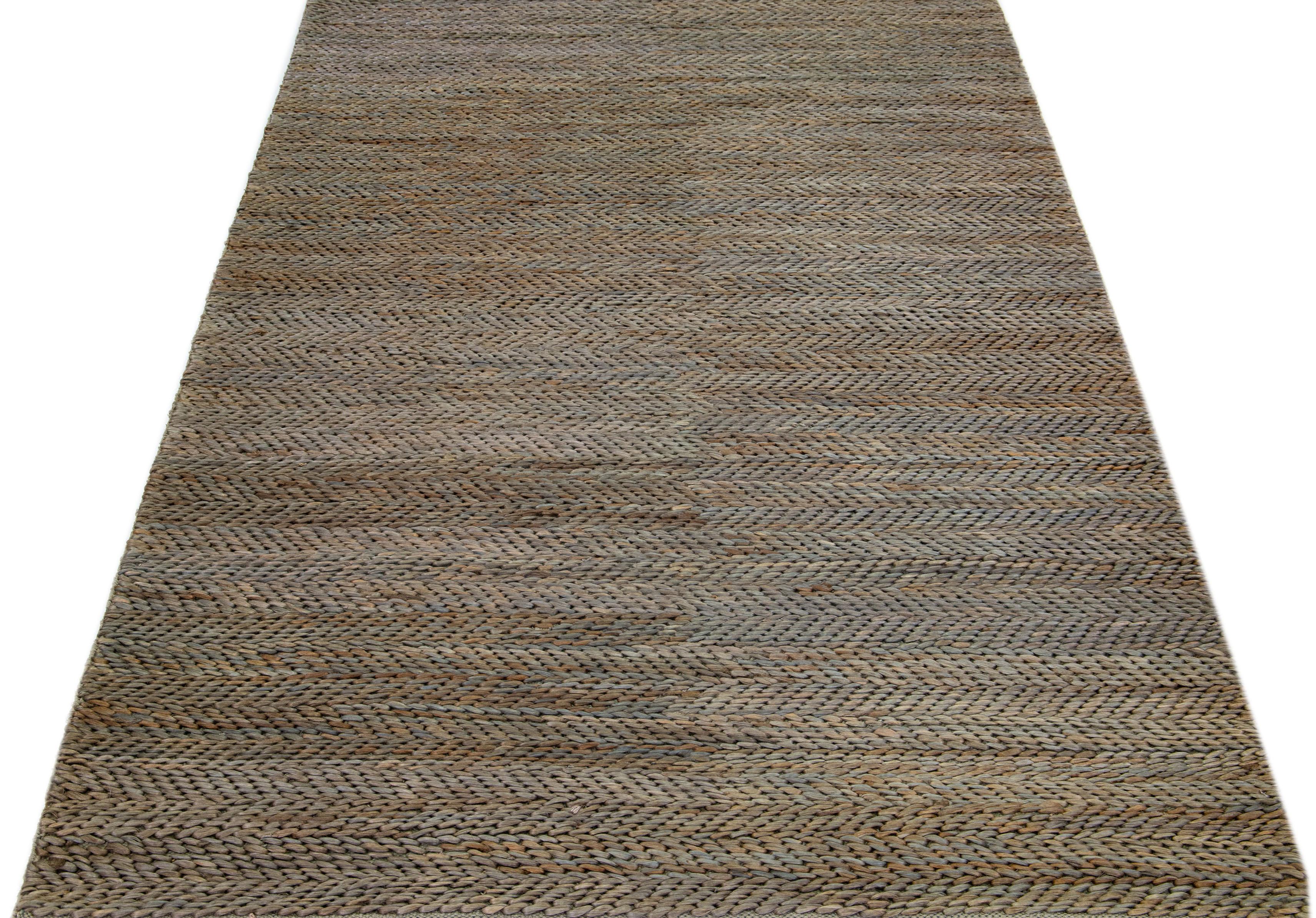 Beautiful natural hand-woven 70% jute and 30% cotton rug with the teal & brown braided field. This Modern rug is perfect for farmhouse, coastal, rustic, bohemian, or contemporary styles of décor. It has a simple solid design that creates subtle