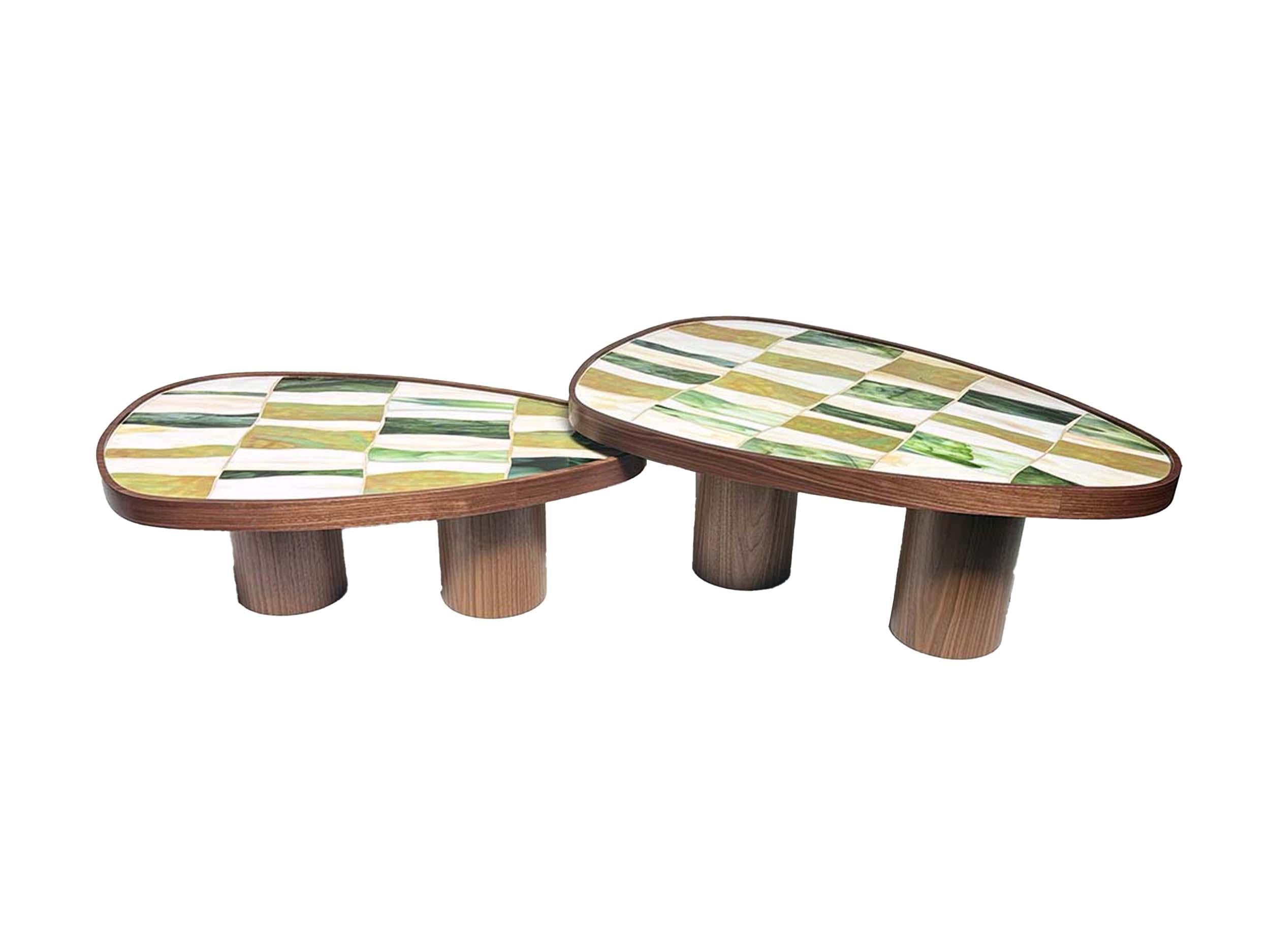 The Modern Nesting Coffee Table Walnut Wood Cylinder Base and Mosaic by Ercole Home features two Walnut pedestal legs, and a top with inset hand-cut mosaic in shades of OG Palazzo Green, River, and Light Ivory. 

Part of the Palazzo collection, the