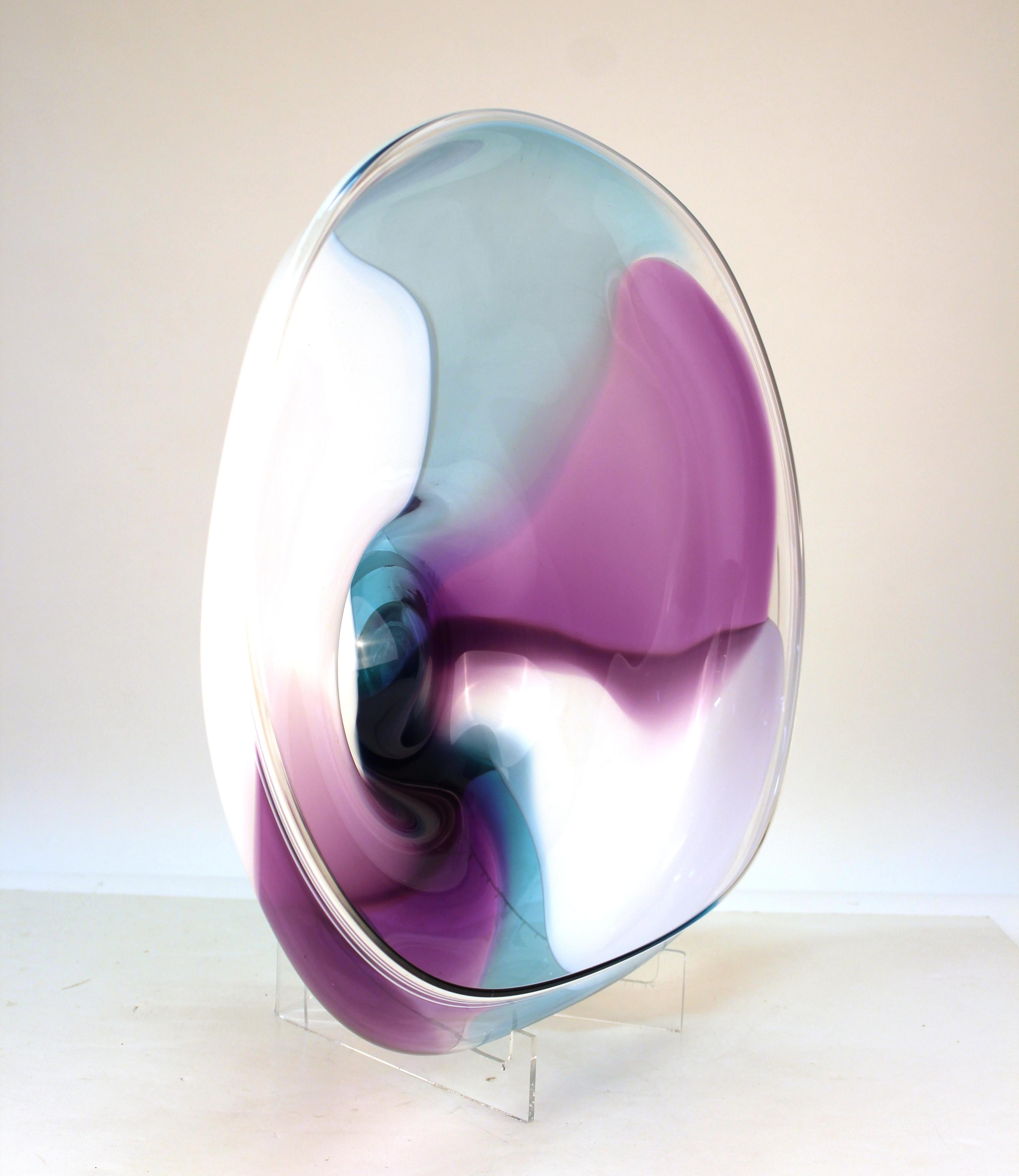 Modern studio art glass 'Wave' bowl by California glass artists Rick & Janet Nicholson, signed and dated on the back. The piece is shaped in a wave form and has transparent colors between layers of clear glass. It was made in 1993 and is in great