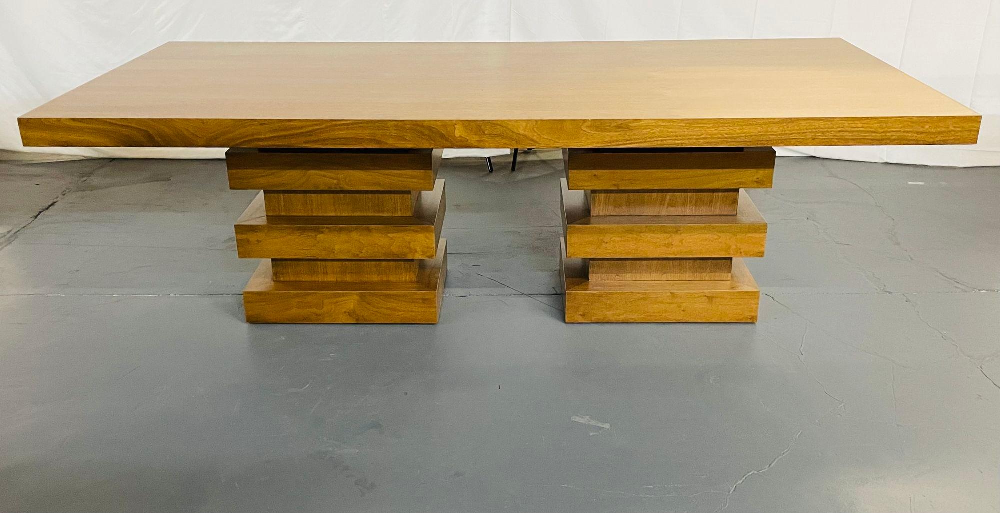 Modern Oak double pedestal base dining / conference table, geometric design 

A solid oak slab table top sitting on solid oak geometric stacked double pedestal bases. This table is very modern in form with a beautiful light shade of brown. The