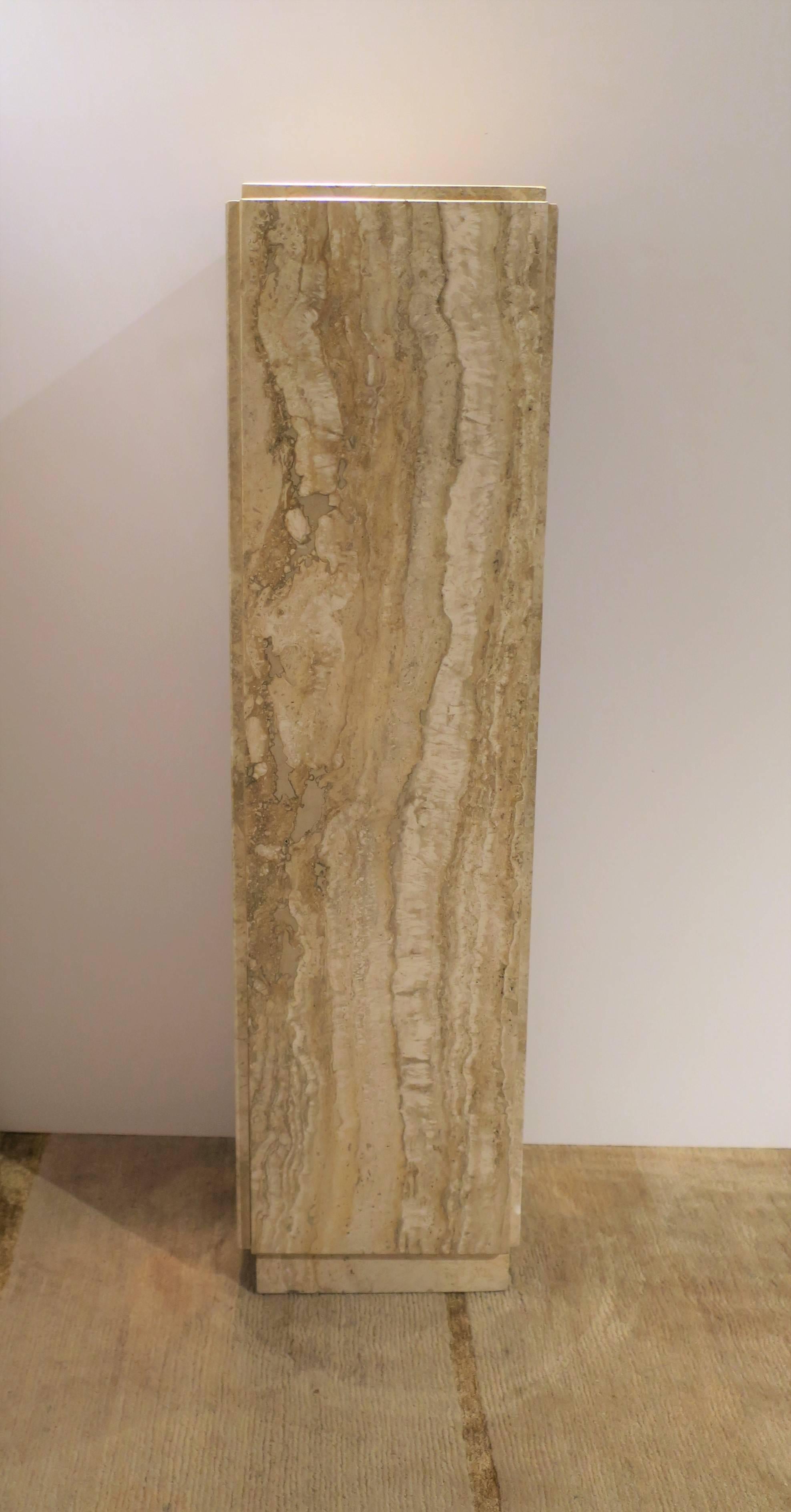A very beautiful Italian travertine marble pedestal column pillar stand in the style of designer Angelo Mangiarotti, '70s modern or Postmodern period, circa 1970s, Italy. Colors include, white, sand, cream, and light browns. The travertine marble