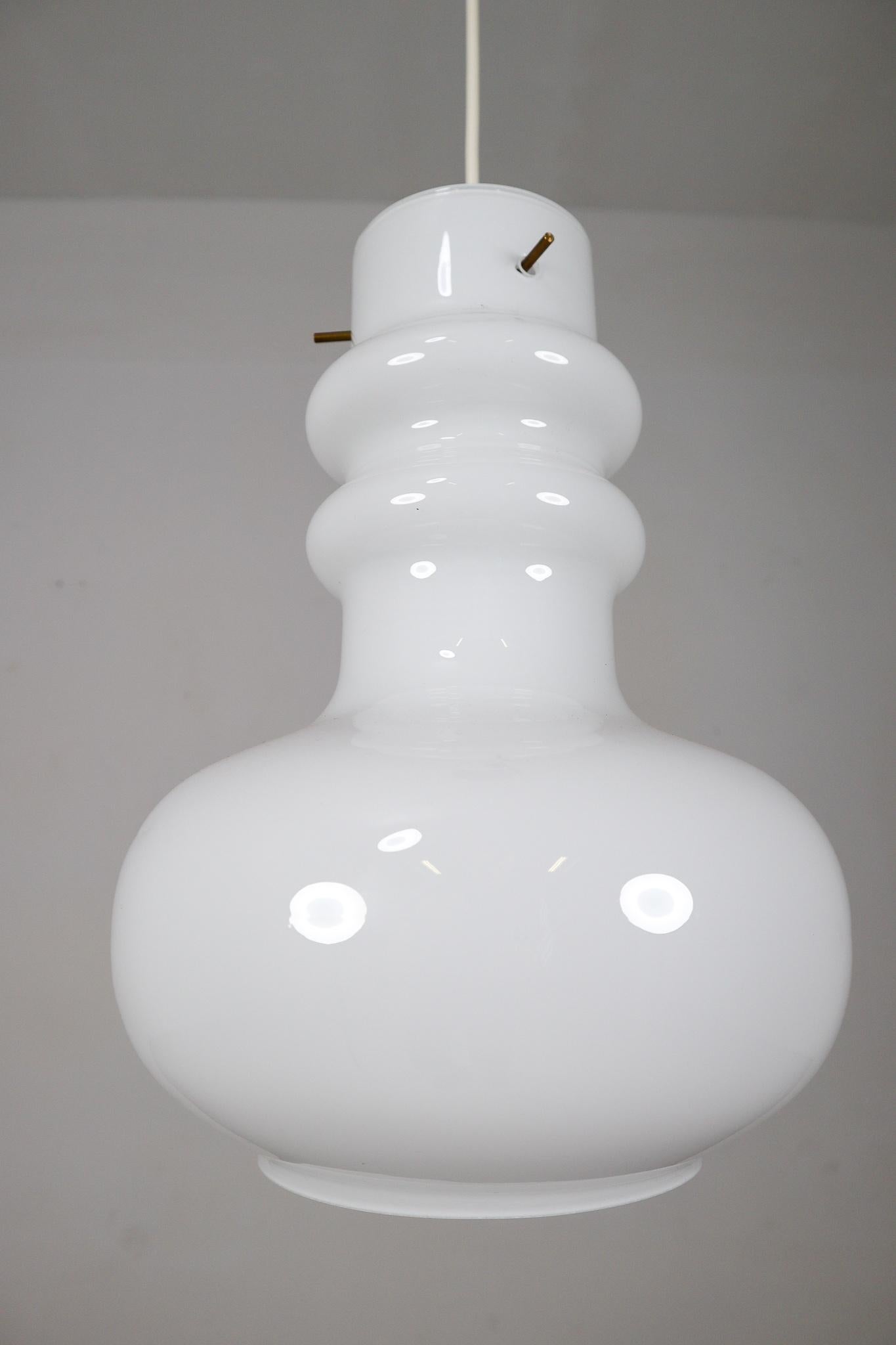 Modern opaline glass pendant lamp, Italy, 1970s. The diffuse light it spreads is very atmospheric. Completed with the white opaline glass and small brass details, these pendants will contribute to a luxury/modern character of the
