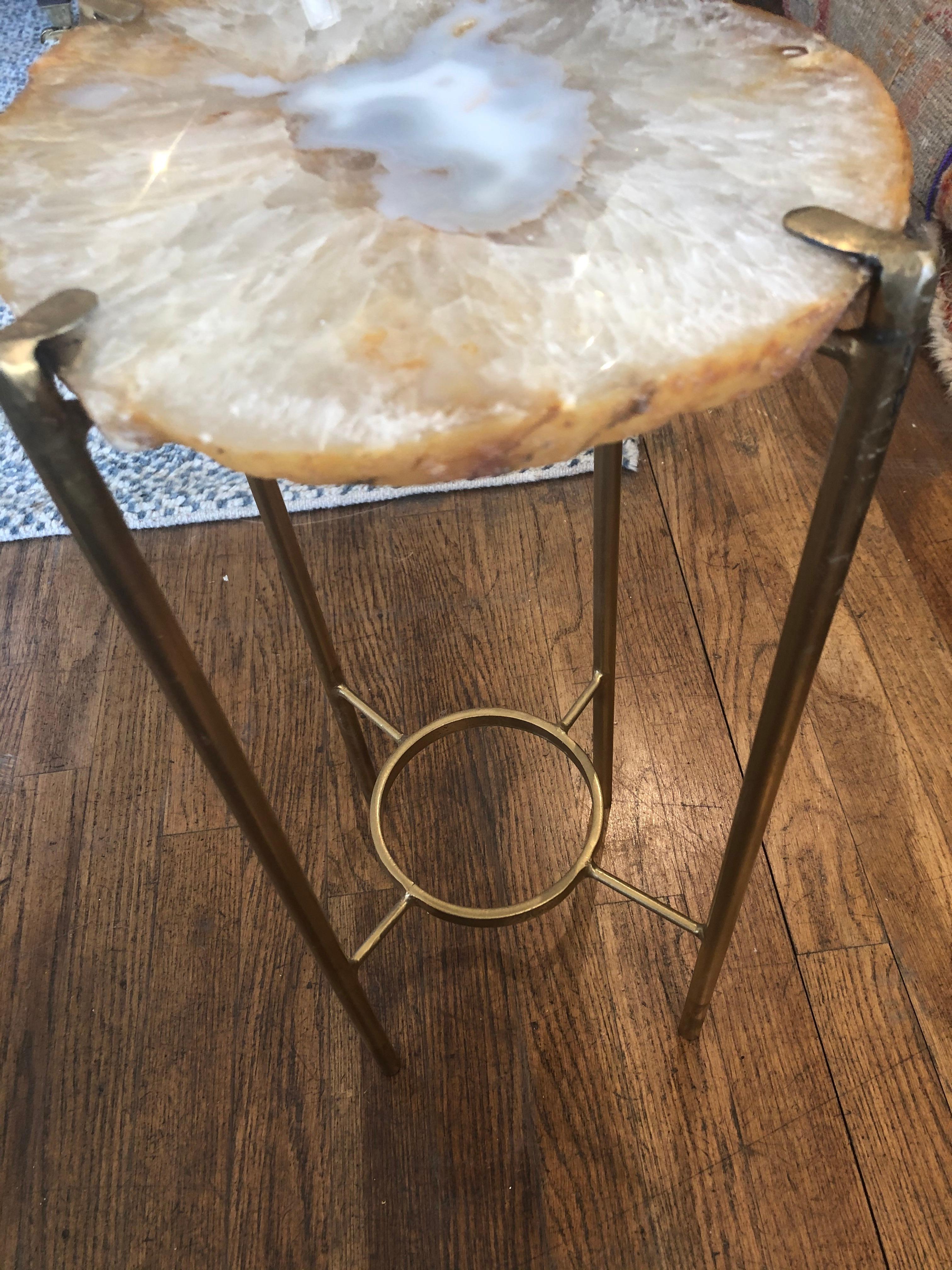 Unusual modern handcrafted drinks table. Large quartzite geode top with gilded steel base.