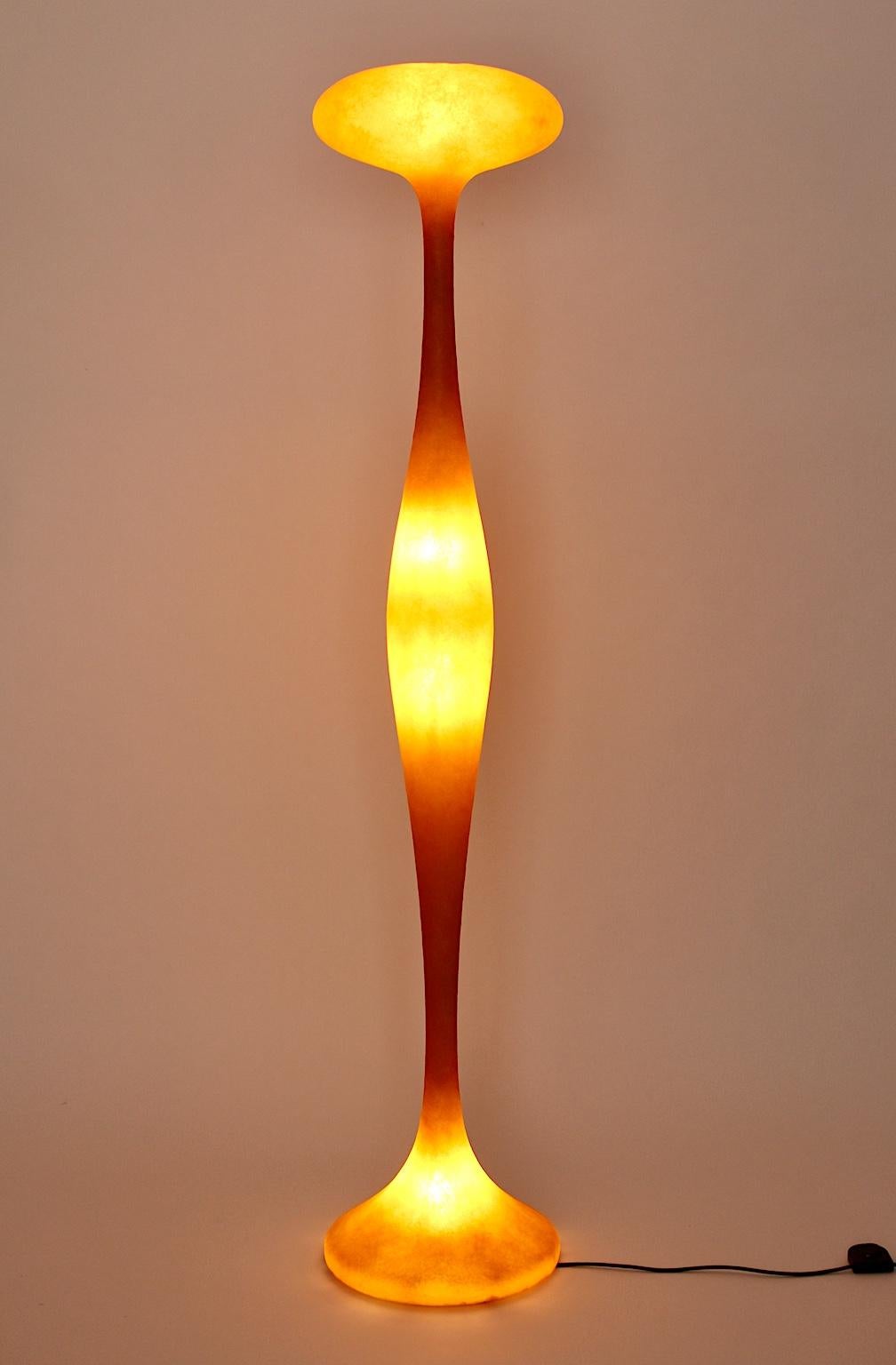A modern orange original vintage Guglielmo Berchicci floor lamp, which was designed for Kundalini, Italy.
The floor lamp´s shape is like a waving column in a futuristic design in a bold color orange.
It was made out of fiberglass, which is layered