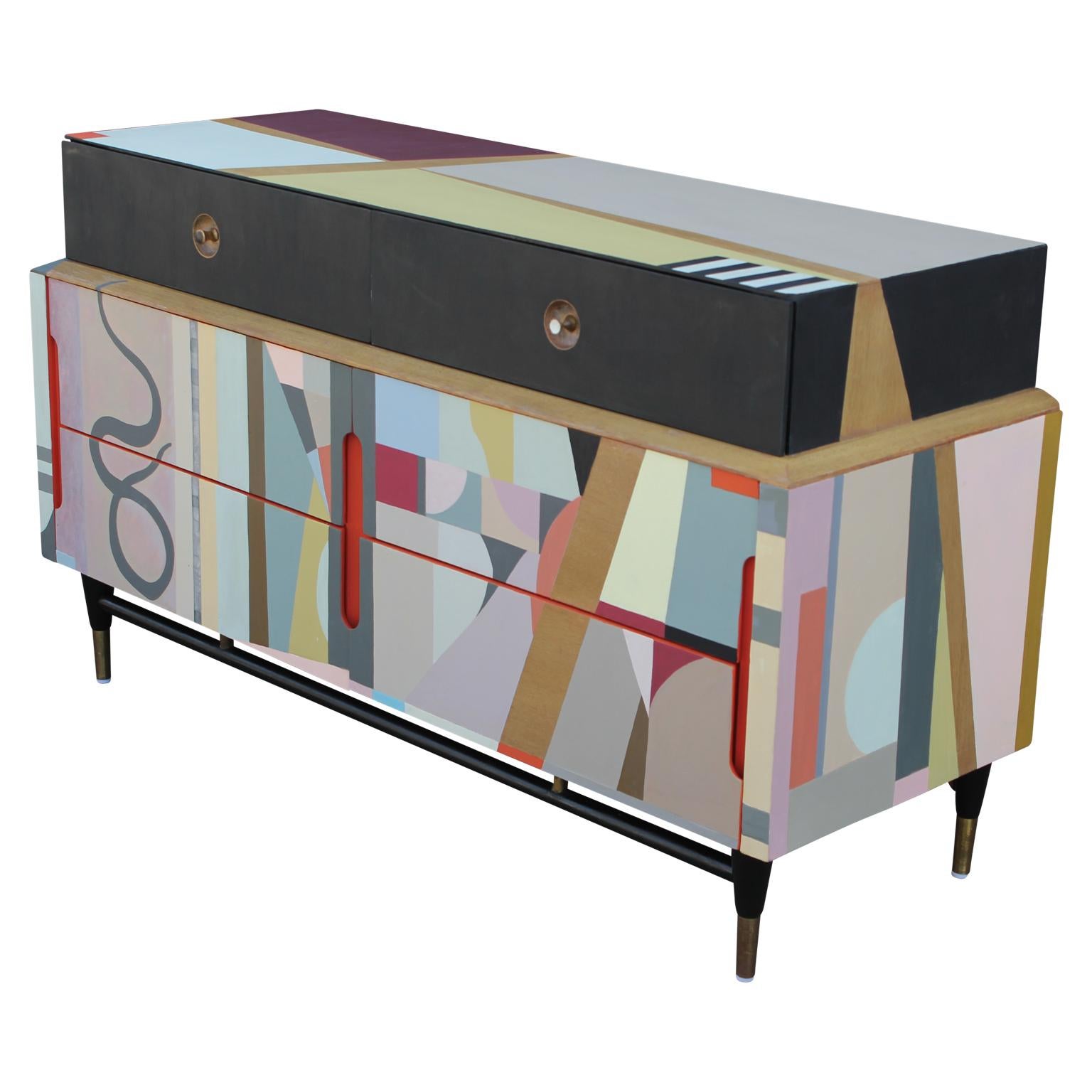 A beautiful modern six-drawer dresser painted in a colorful custom abstract design. This whimsical design and playful characteristic will brighten up any room.