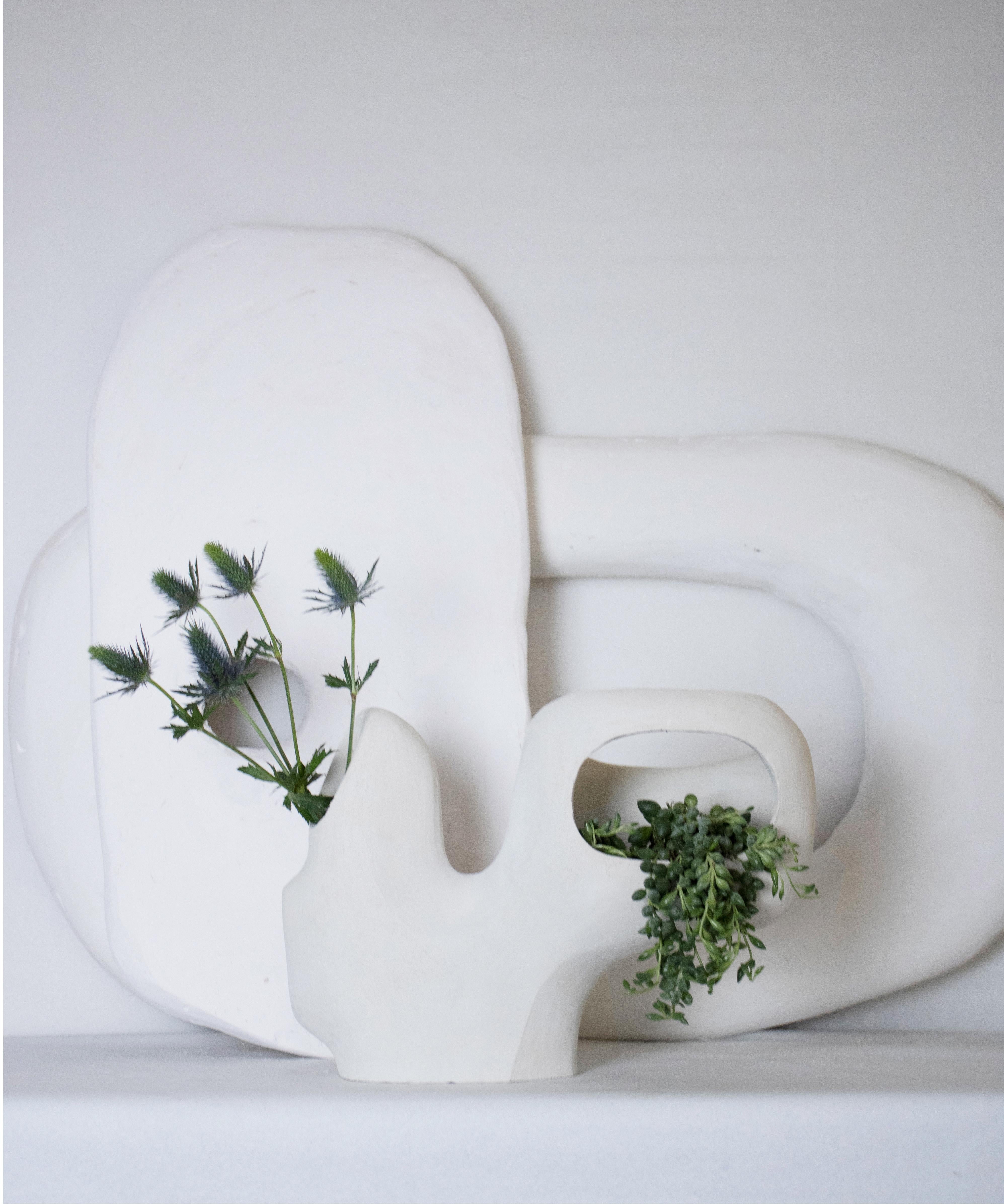 Vase No_05 is a handmade ceramic ikebana vase part of the Kado Collection “way of flowers”. All elements are the result of experimenting between the shape and the various possibilities of plant arrangement. We drew inspiration from the traditional