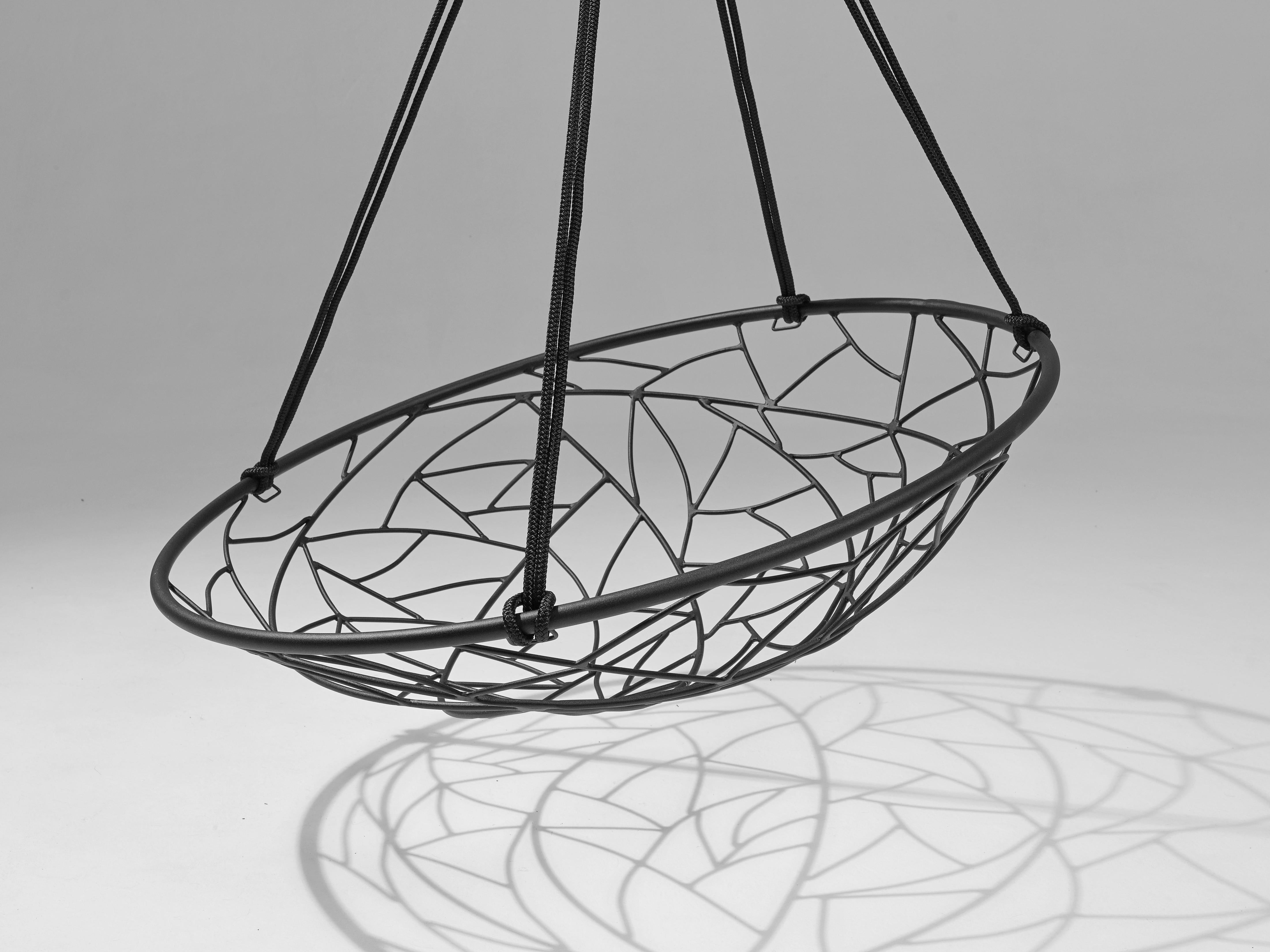 The Basket hanging chair swing seat's round shape creates a cozy feel. It is simple and striking in its visual appeal. 

The twig pattern detail is reminiscent of tree branches that intersect, grasses that are intertwined, the veins in dragonfly