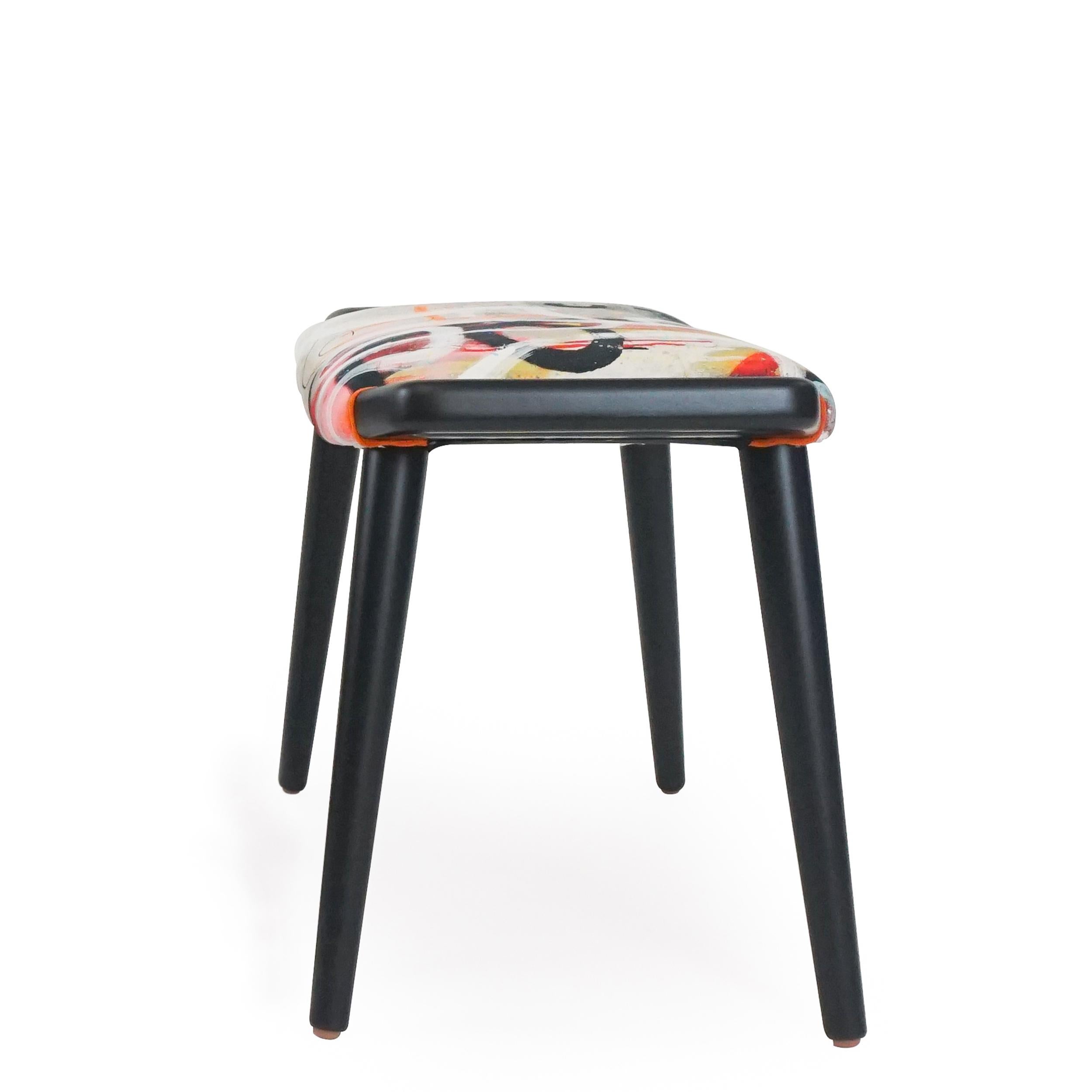 About this piece
Solid hardwood ottoman lacquered in black with matte finish. Upholstered in cotton graffiti print. Can be used as occasional seating, ottoman or cocktail table with tray.

Price is per one ottoman in fabric shown. This customizable