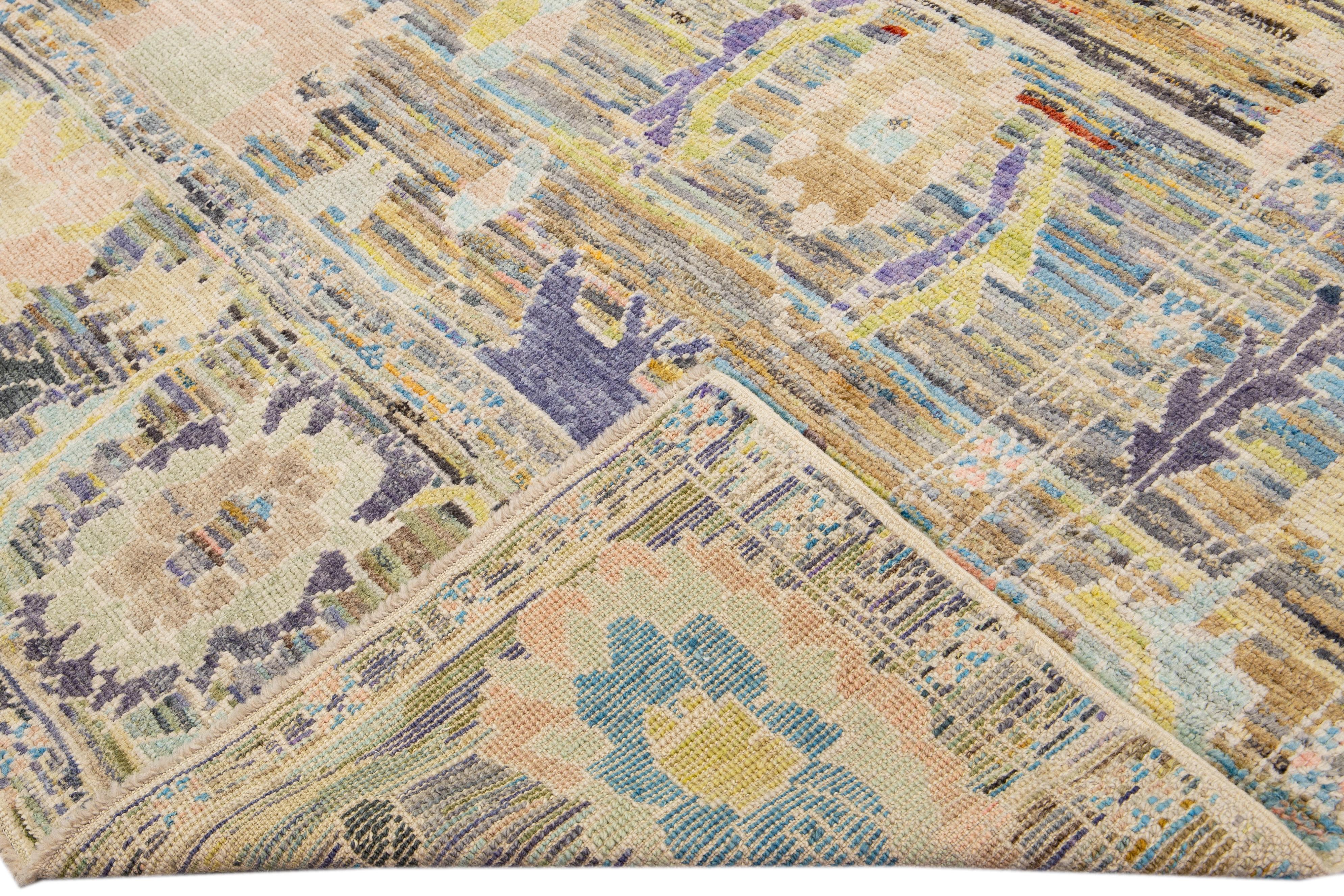 Beautiful modern Oushak hand-knotted wool rug with a multicolor field. This Oushak rug has a purple, gray, peach, and blue accents layout a gorgeous geometric floral pattern design. 

This rug measures: 8'11