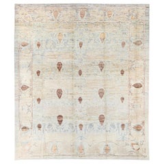 Tapis moderne Oushak en laine beige et bleu à motifs floraux tribaux faits à la main
