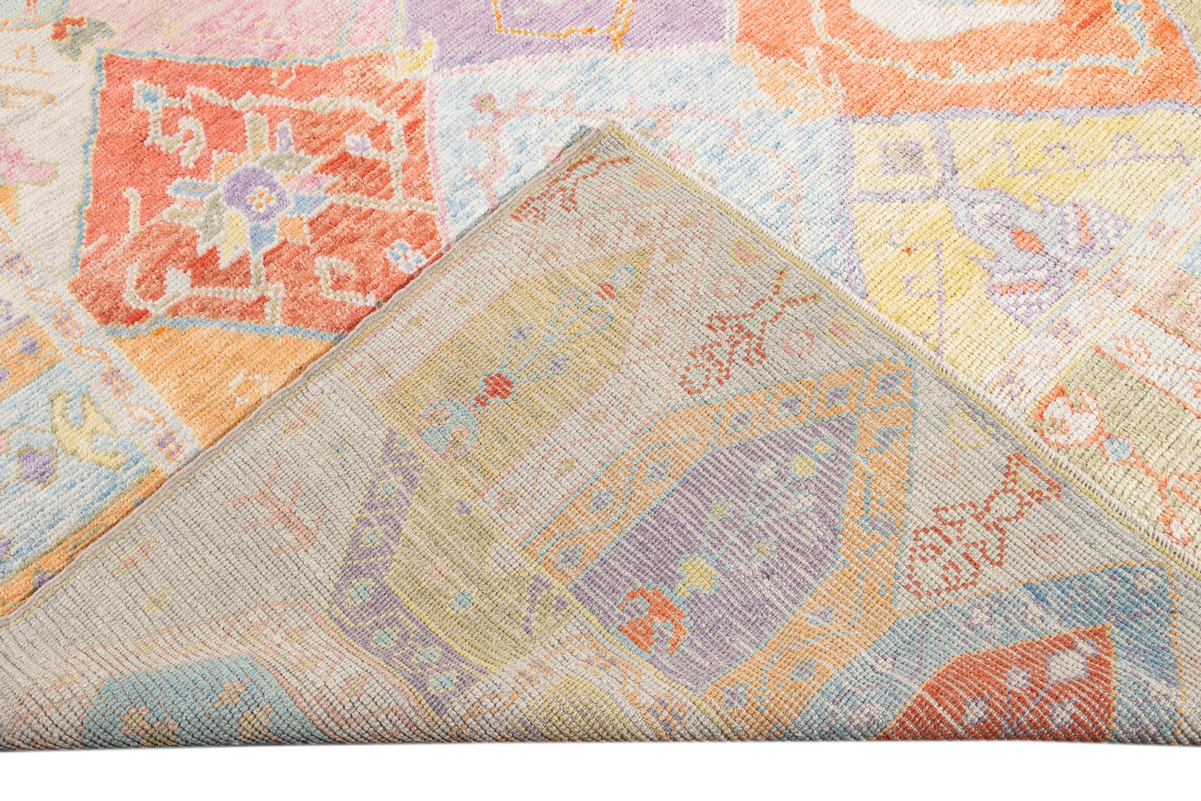 Beautiful modern Oushak hand-knotted wool rug with a multicolor field. This piece has a gorgeous all-over geometric floral design.

This rug measures: 10'6