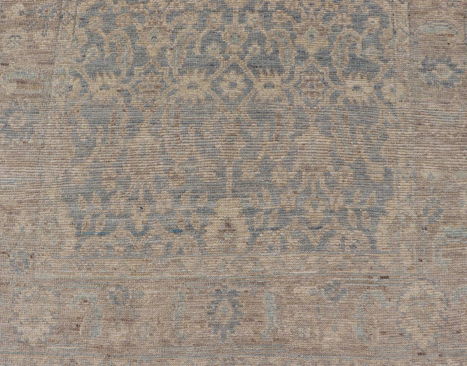 Modern Oushak Rug with a Light Greenish Ground and All-Over Floral Motifs. Keivan Woven Arts; rug AWR-8008 Country of Origin: Afghanistan Type: Oushak Design: All-Over, Floral 

Measures: 3'8 x 5'10 

Hand-Knotted in wool, this rustic looking