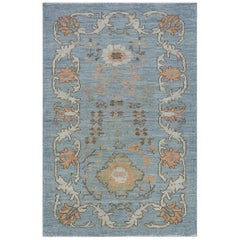 Modern Oushak Rug in Blue with Floral Design Motifs in Ivory, Pink and Brown