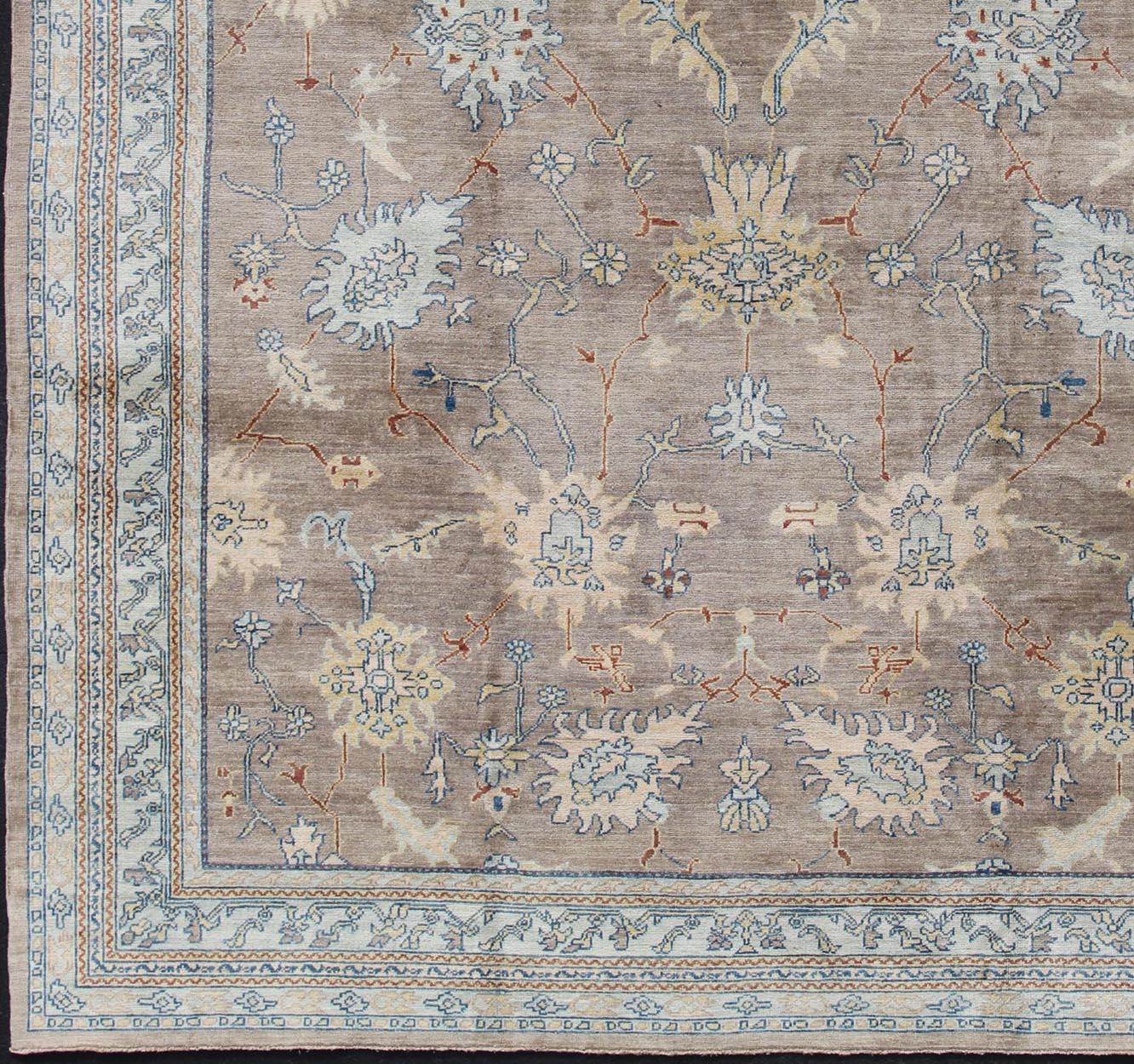 Oushak rug with gray, blue, neutral color palette and all-over flower design, rug 1912-259, country of origin / type: Afghan / Oushak.

This traditional Oushak rug from Afghan features an all-over design of floral shapes, surrounded beautifully by