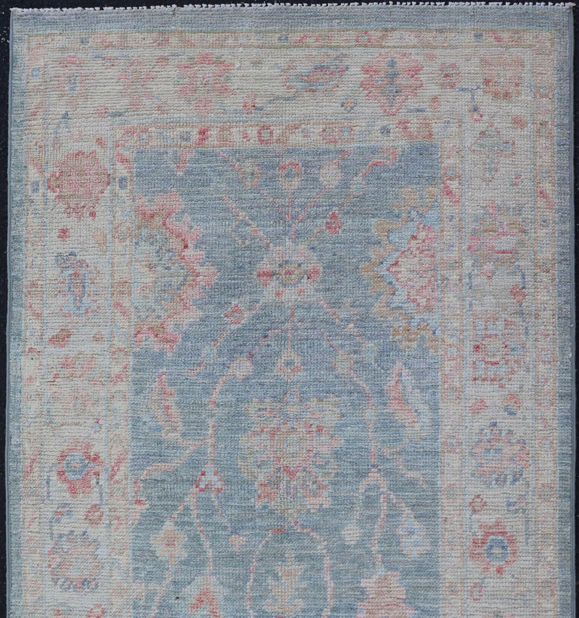 Measures: 2'11 x 5'8 
Modern Oushak Rug with a Light Blue Field With All-Over Floral Motifs With Cream. Keivan Woven Arts; rug AWR-12202 Country of Origin: Afghanistan Type: Oushak Design: All-Over, Floral. 
Hand-Knotted in wool this piece holds
