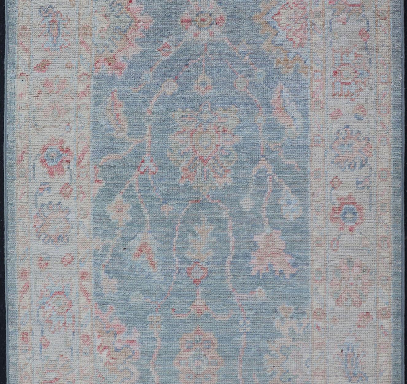 Afghan Modern Oushak Rug with a Light Blue Field With All-Over Floral Motifs With Cream For Sale
