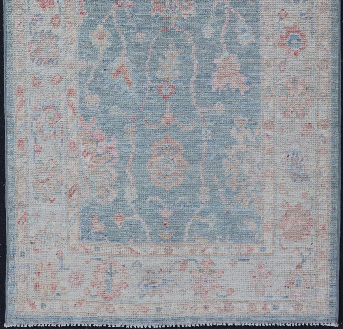 Hand-Knotted Modern Oushak Rug with a Light Blue Field With All-Over Floral Motifs With Cream For Sale
