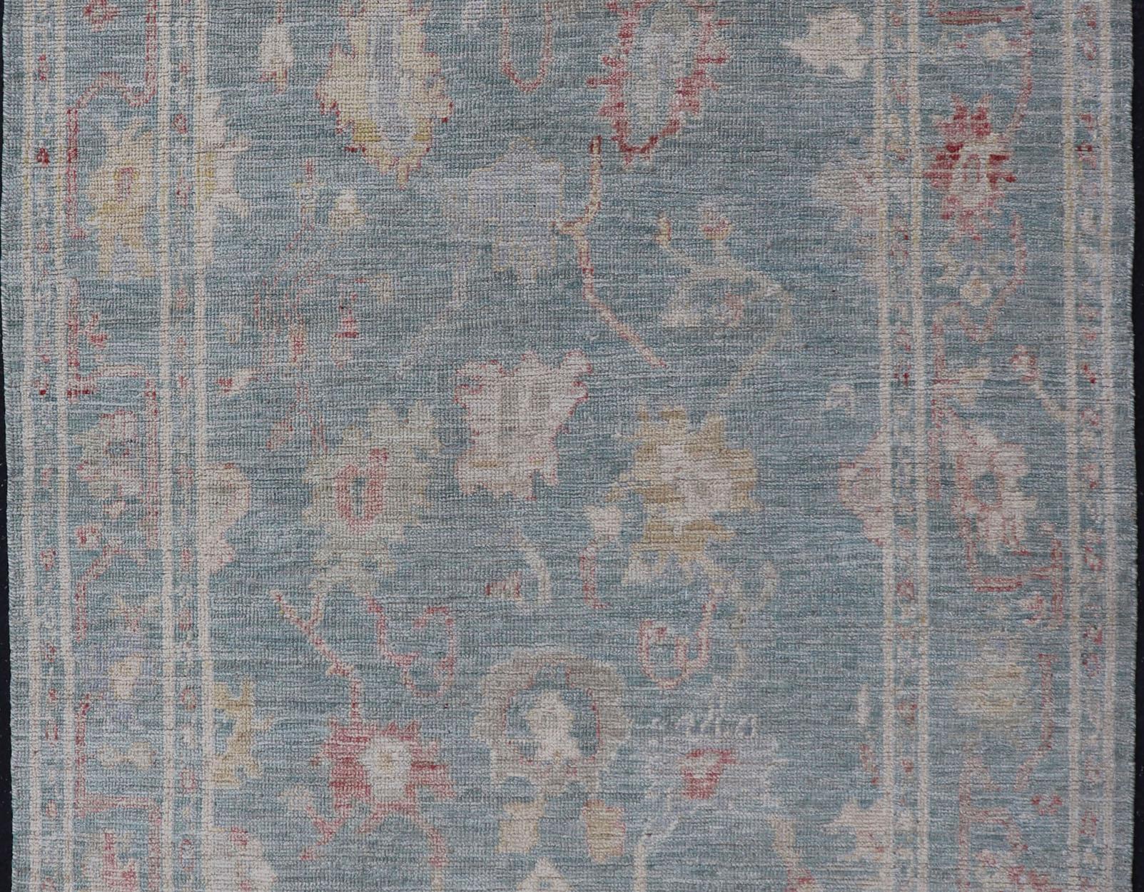 Measures: 3'11 x 5'11
Modern Oushak Rug with a Light Blue-Gray Field With All-Over Floral Motifs. Keivan Woven Arts; rug AWR-12302 Country of Origin: Afghanistan Type: Oushak Design: All-Over, Floral. 
Hand-Knotted in wool, this rustic piece holds